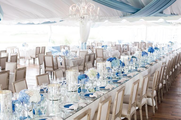 Outdoor Wedding Reception Tables With Blue Hydrangea Centerpieces And Mercury Glass Vases