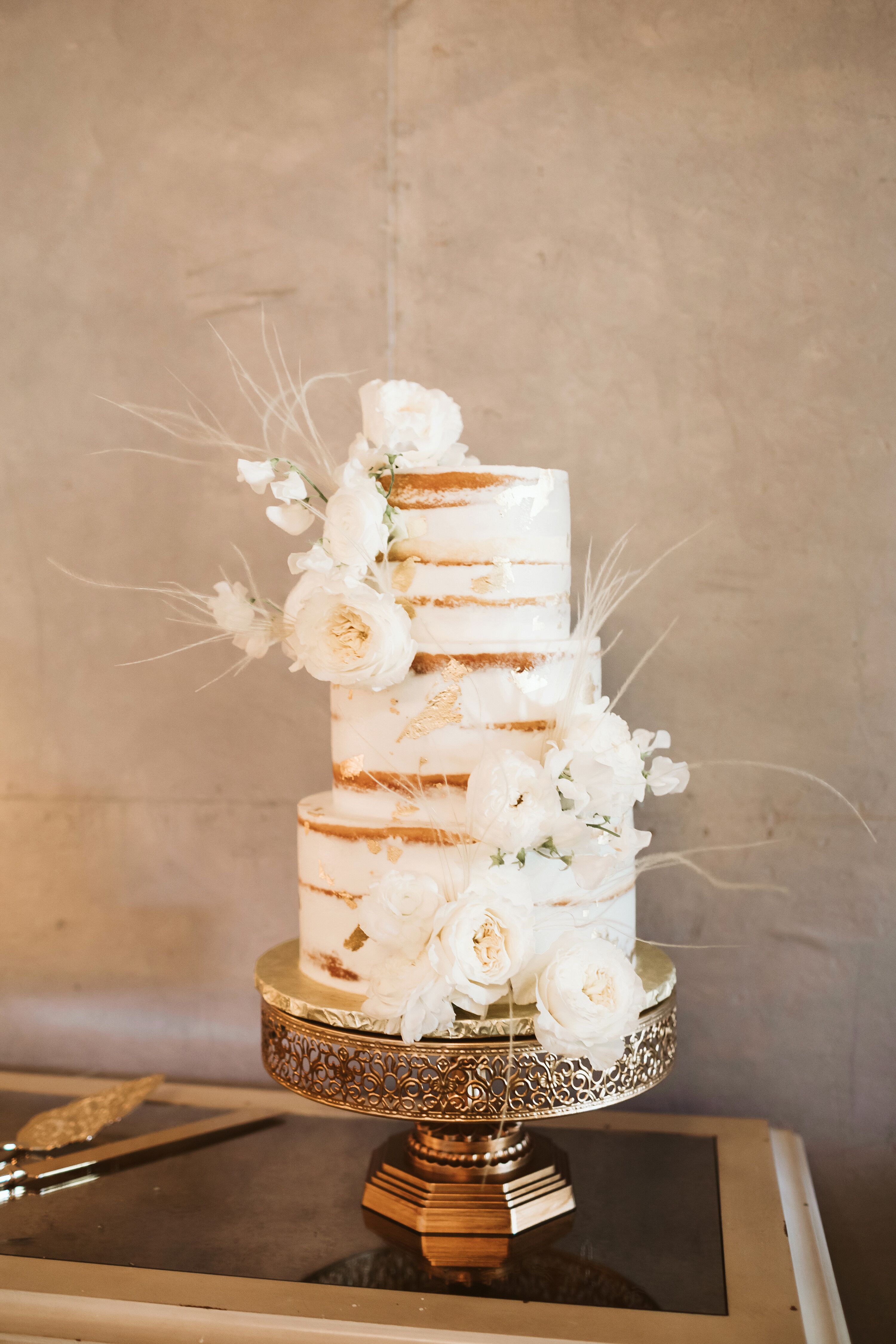 Semi Naked Tiered Cake With Fresh White Flowers