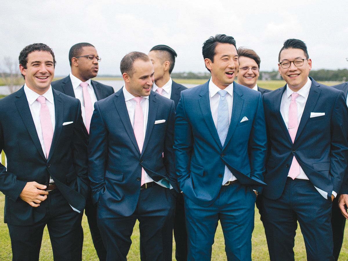 Groom and groomsmen in navy tuxedos