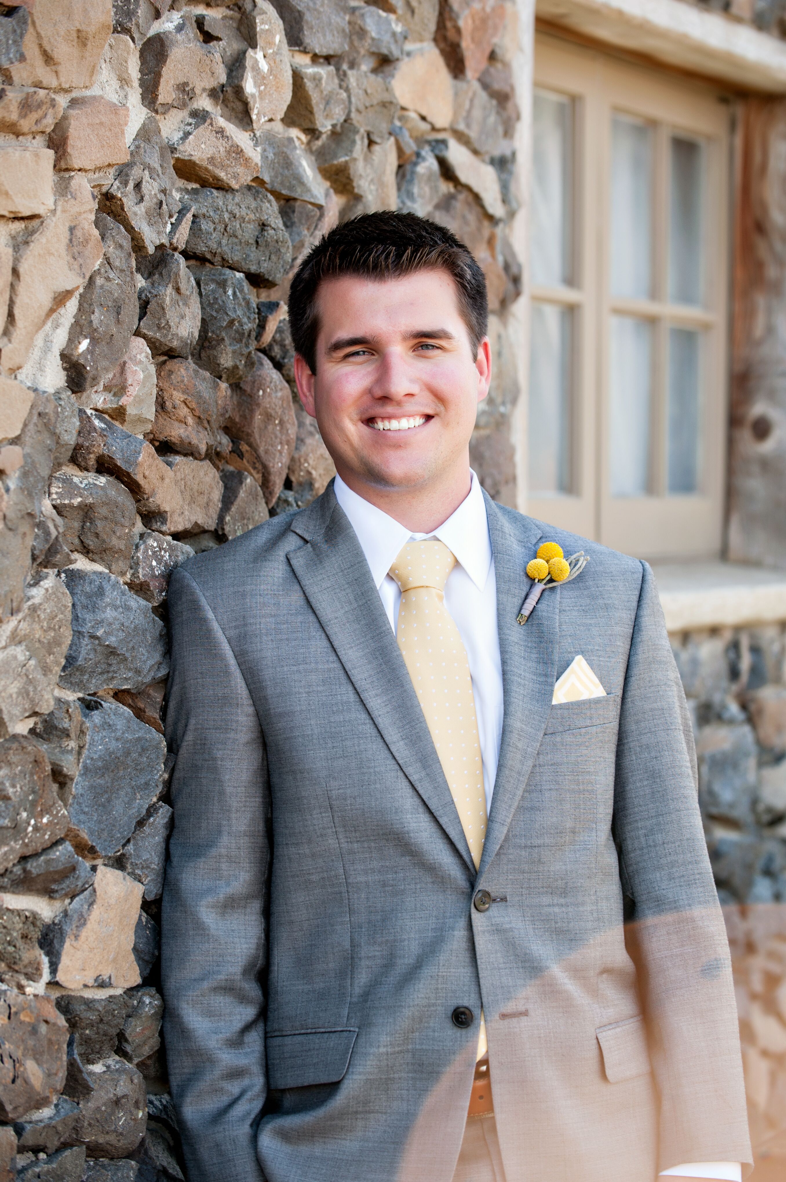 Gray Groom Suit With Yellow Tie And Pocket Square