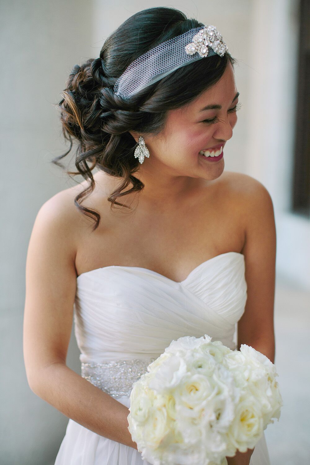 Smiling Bride Holding Her Bouquet