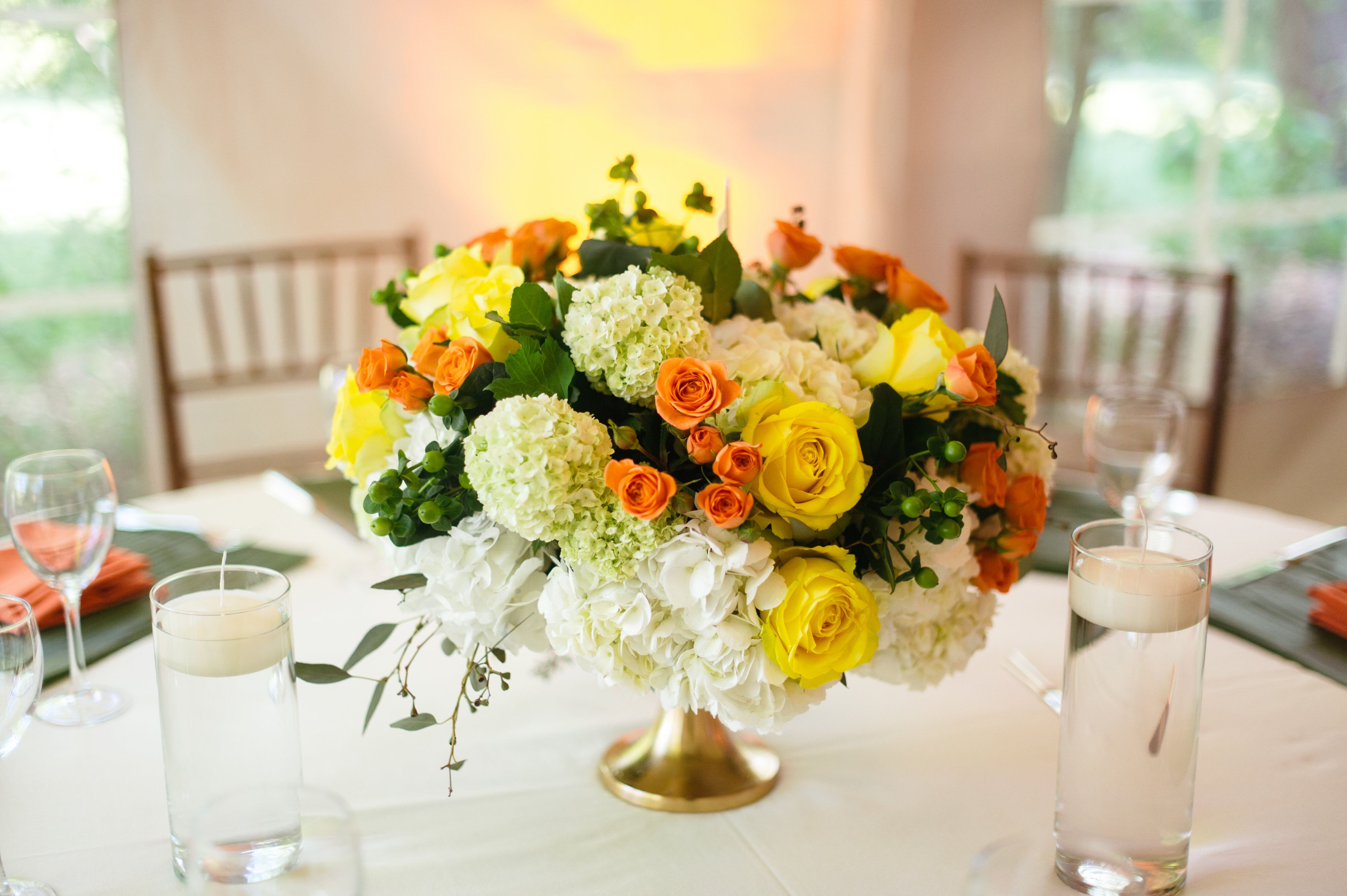 Bright Rose and Hydrangea Centerpiece in Gold Urn