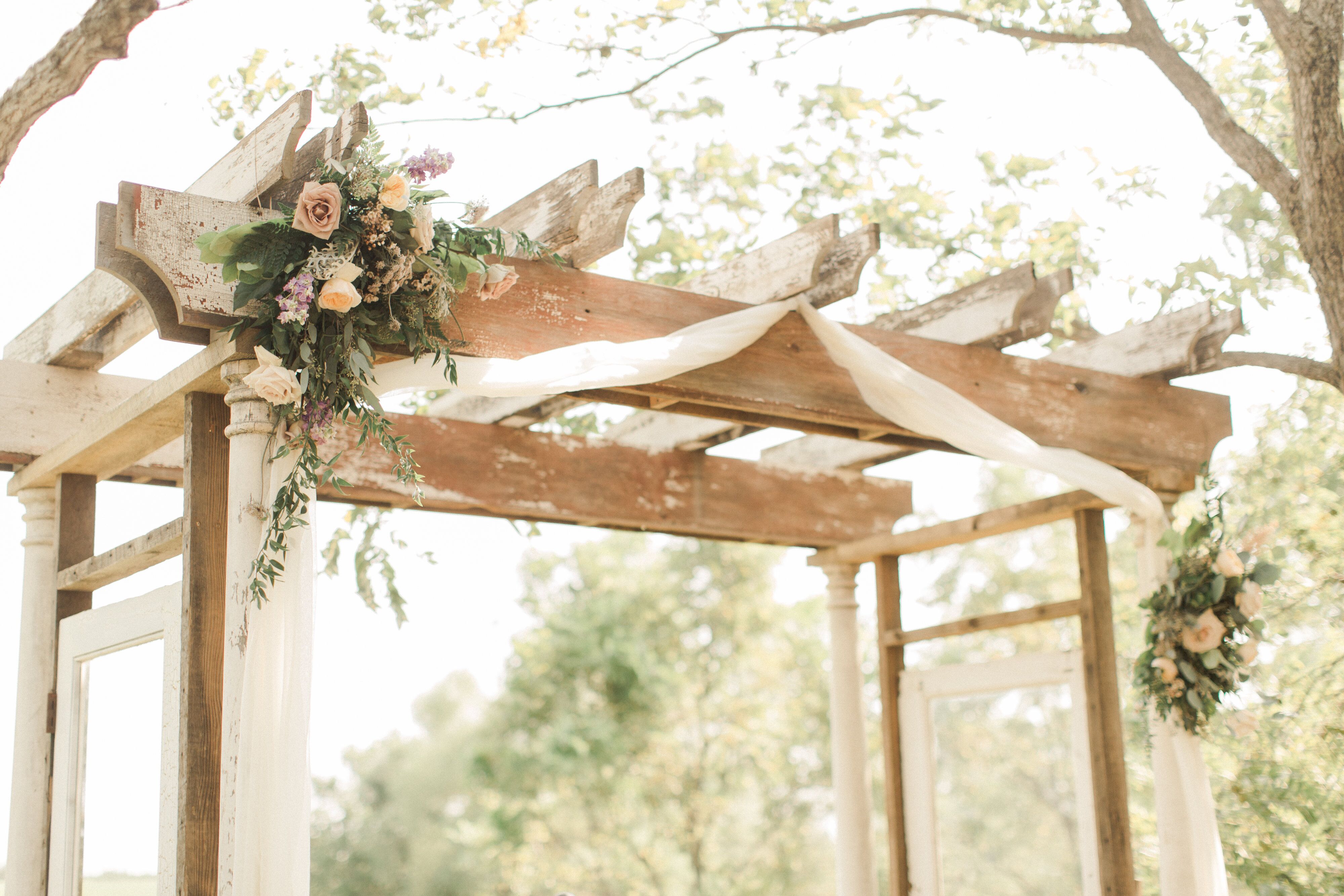 Wood Ladder Wedding Arch Draped in Fabric