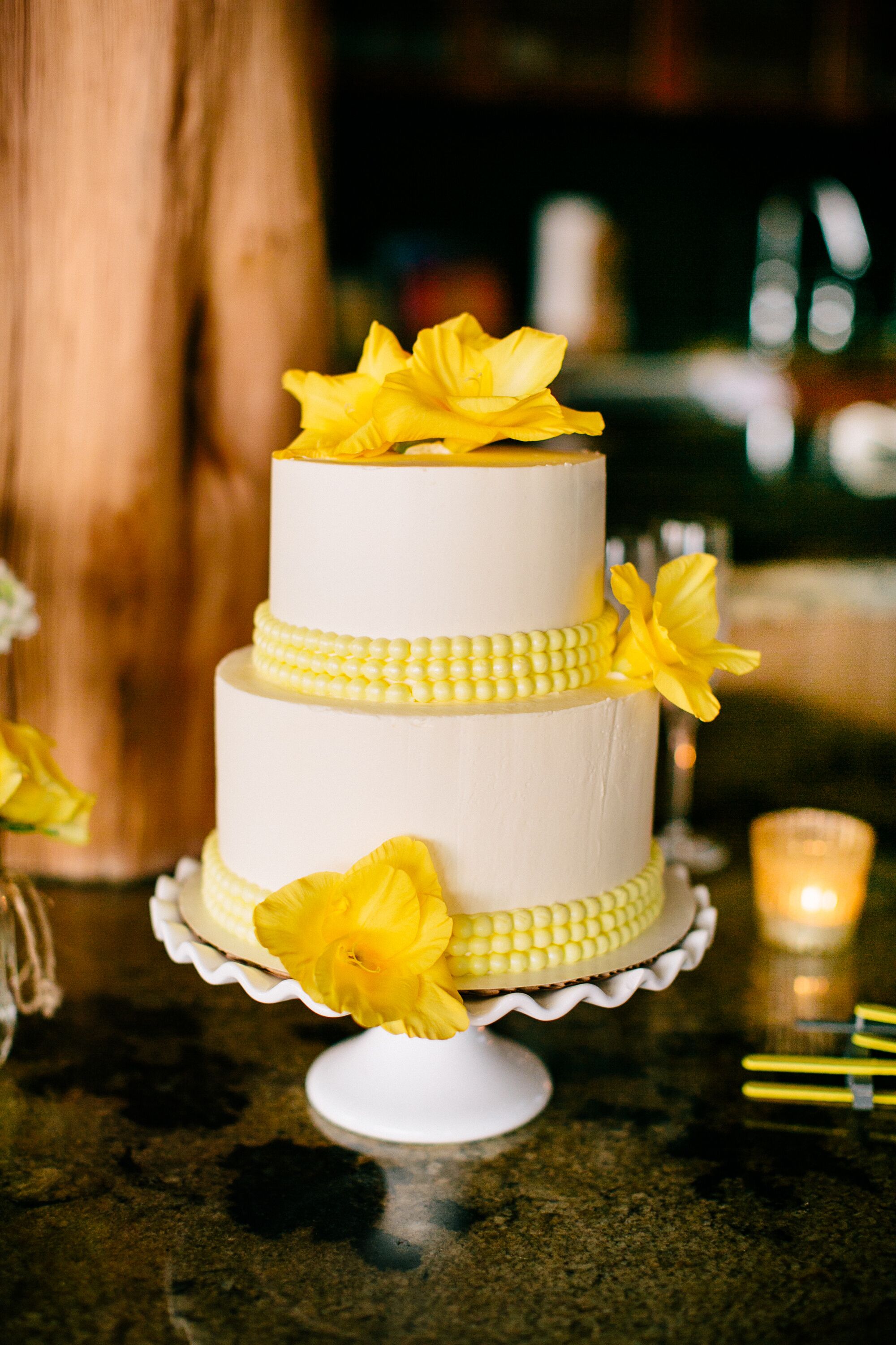 Yellow and White Tiered Fondant Wedding Cake