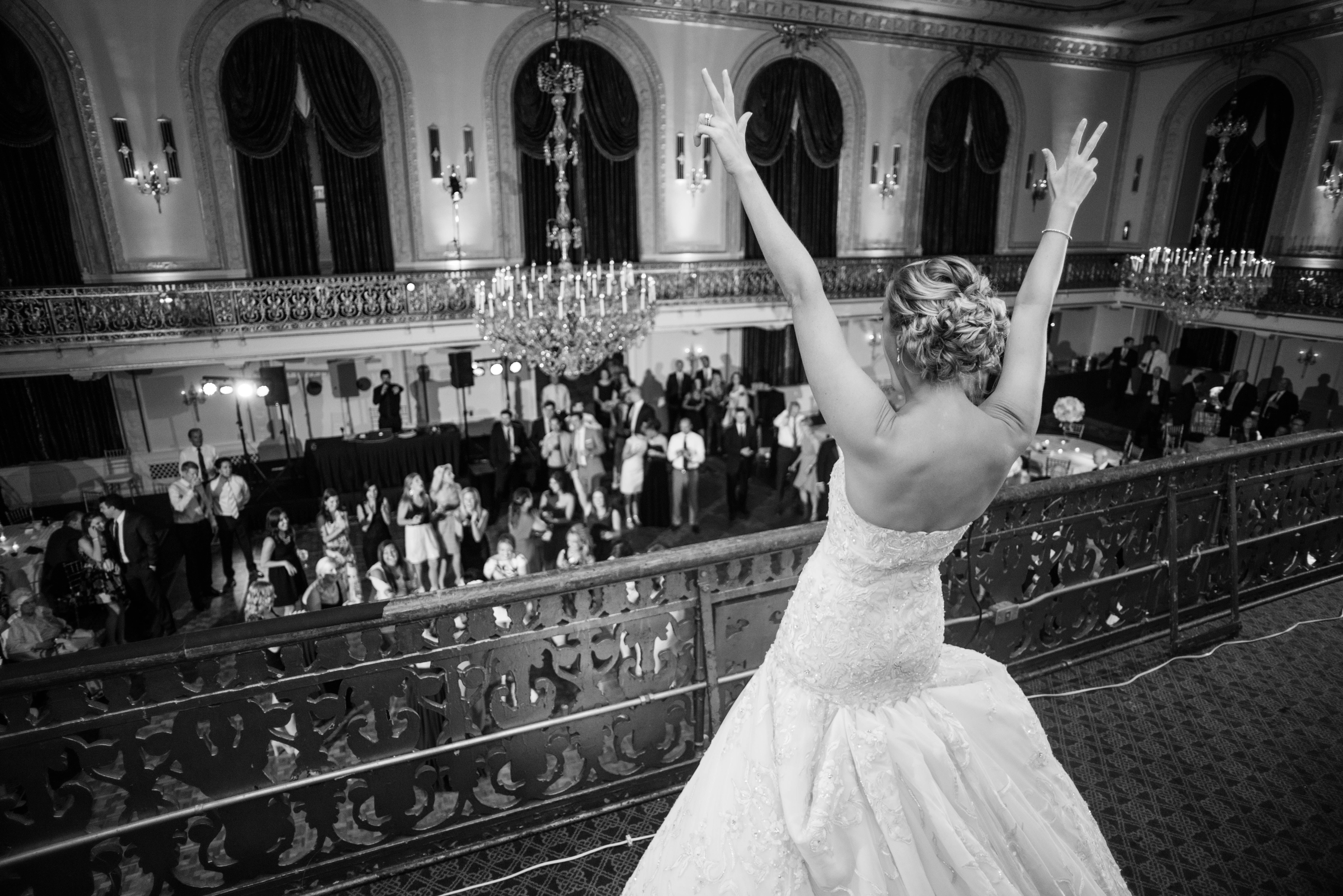 Bouquet Toss From Balcony At Ballroom Reception