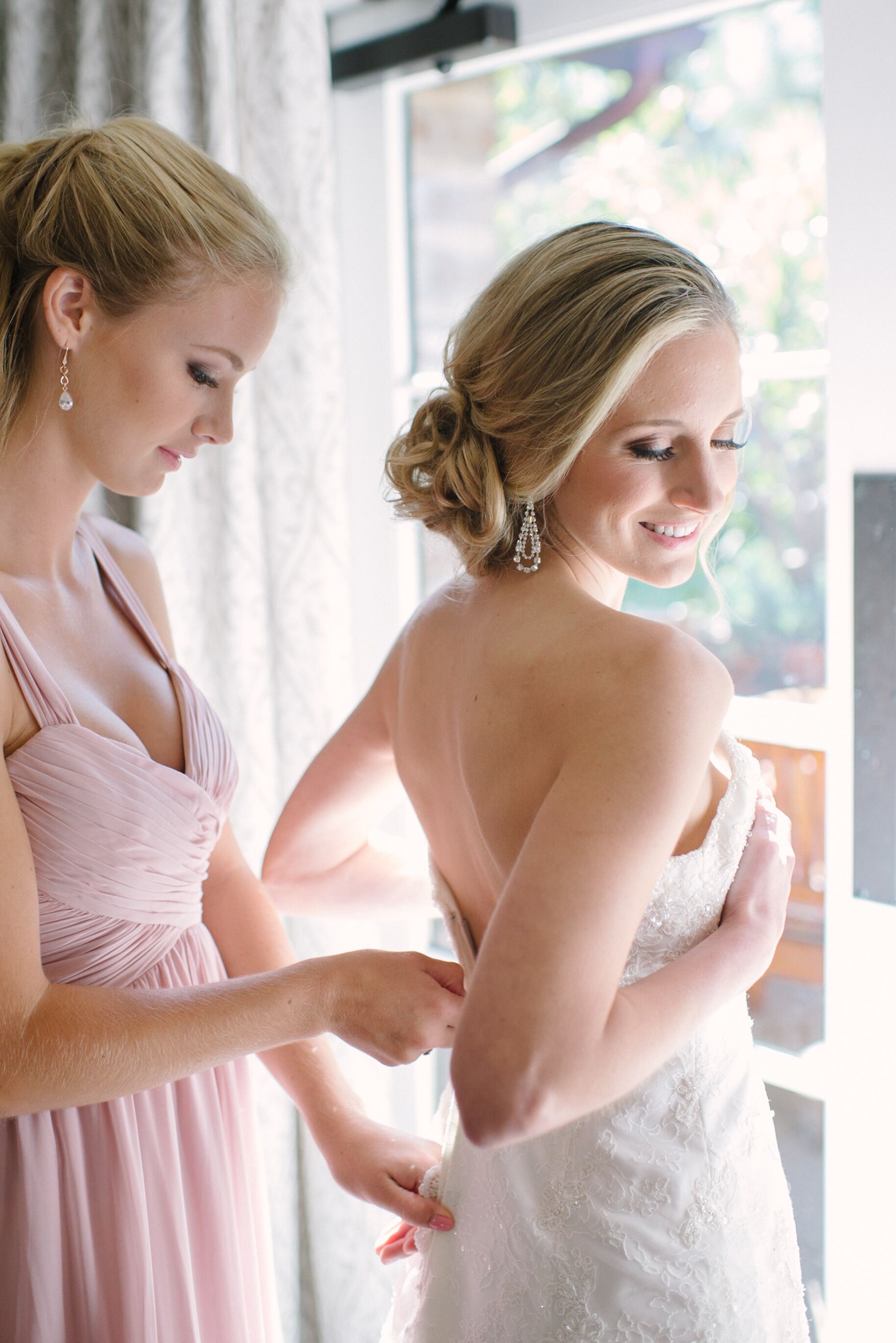 Bride Putting On Wedding Dress 6345