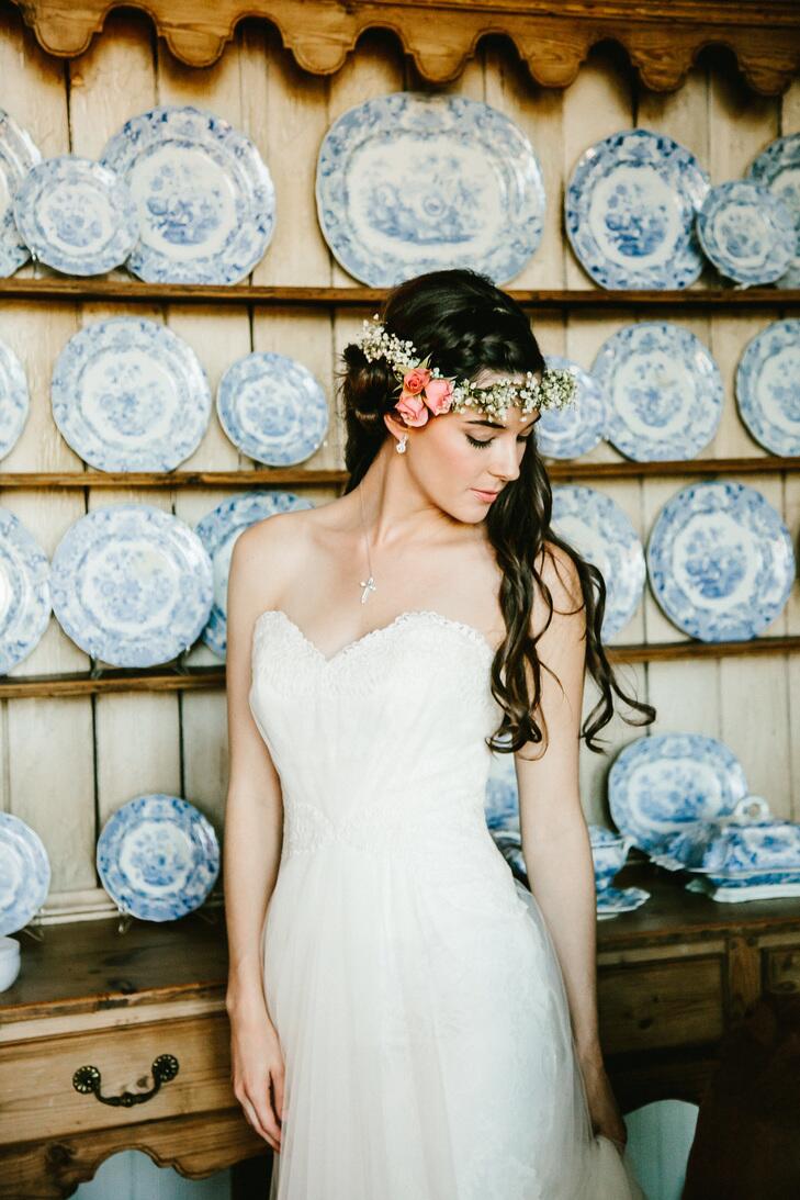 Bride in strapless dress wearing a floral crown