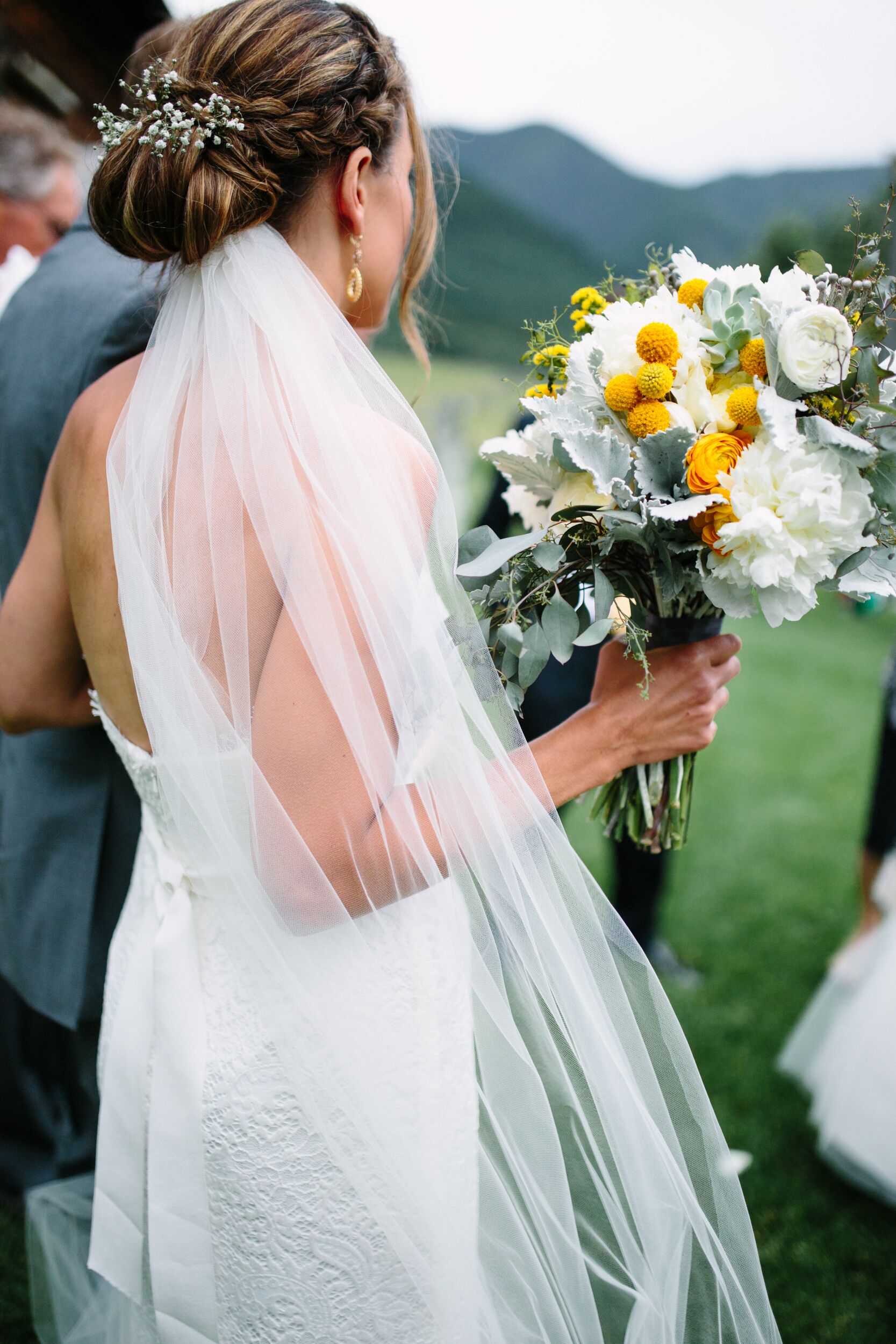 White Baby's Breath-Decorated Bridal Updo Wedding Hairstyle