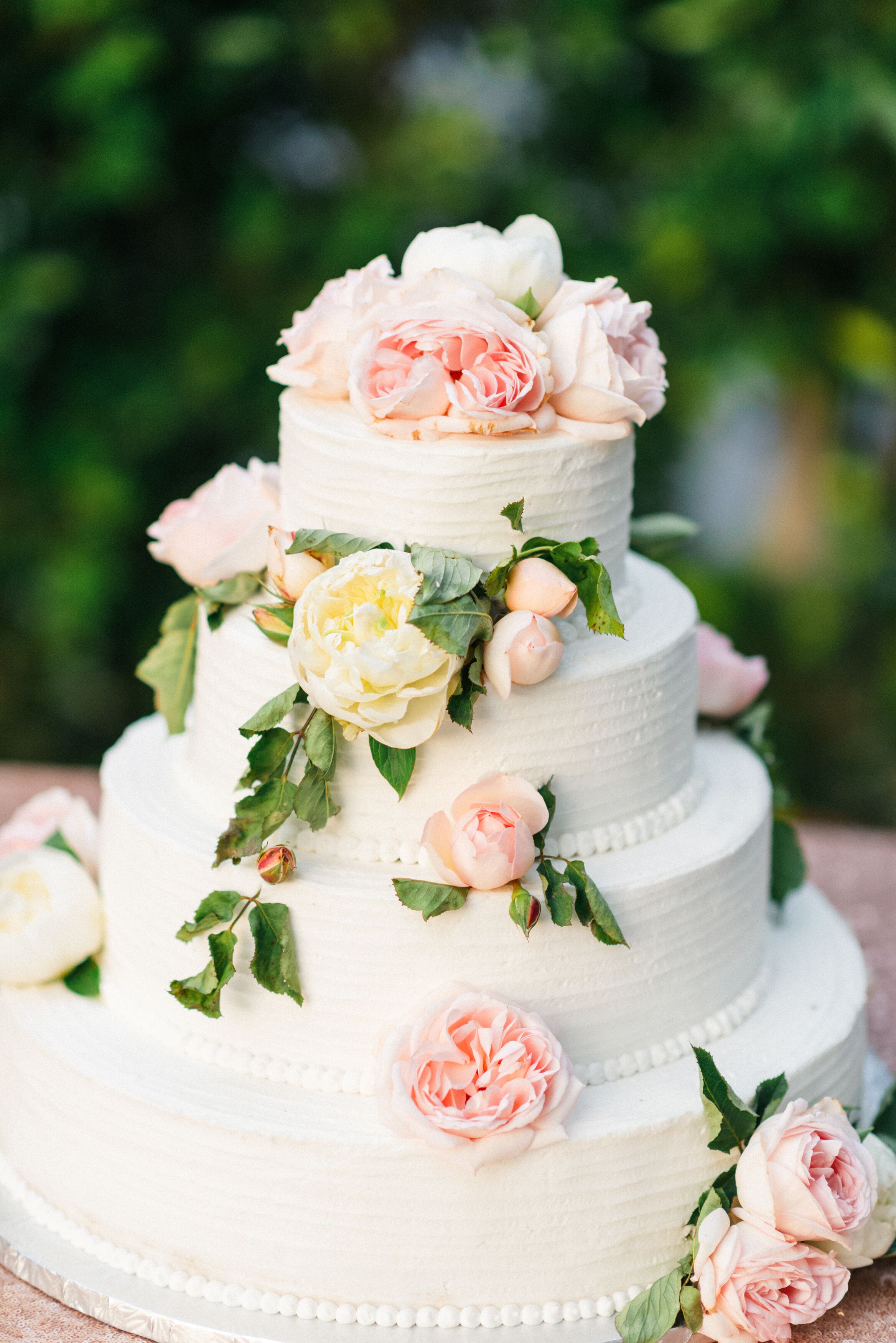 White Wedding Cake With Pink Peonies and Roses