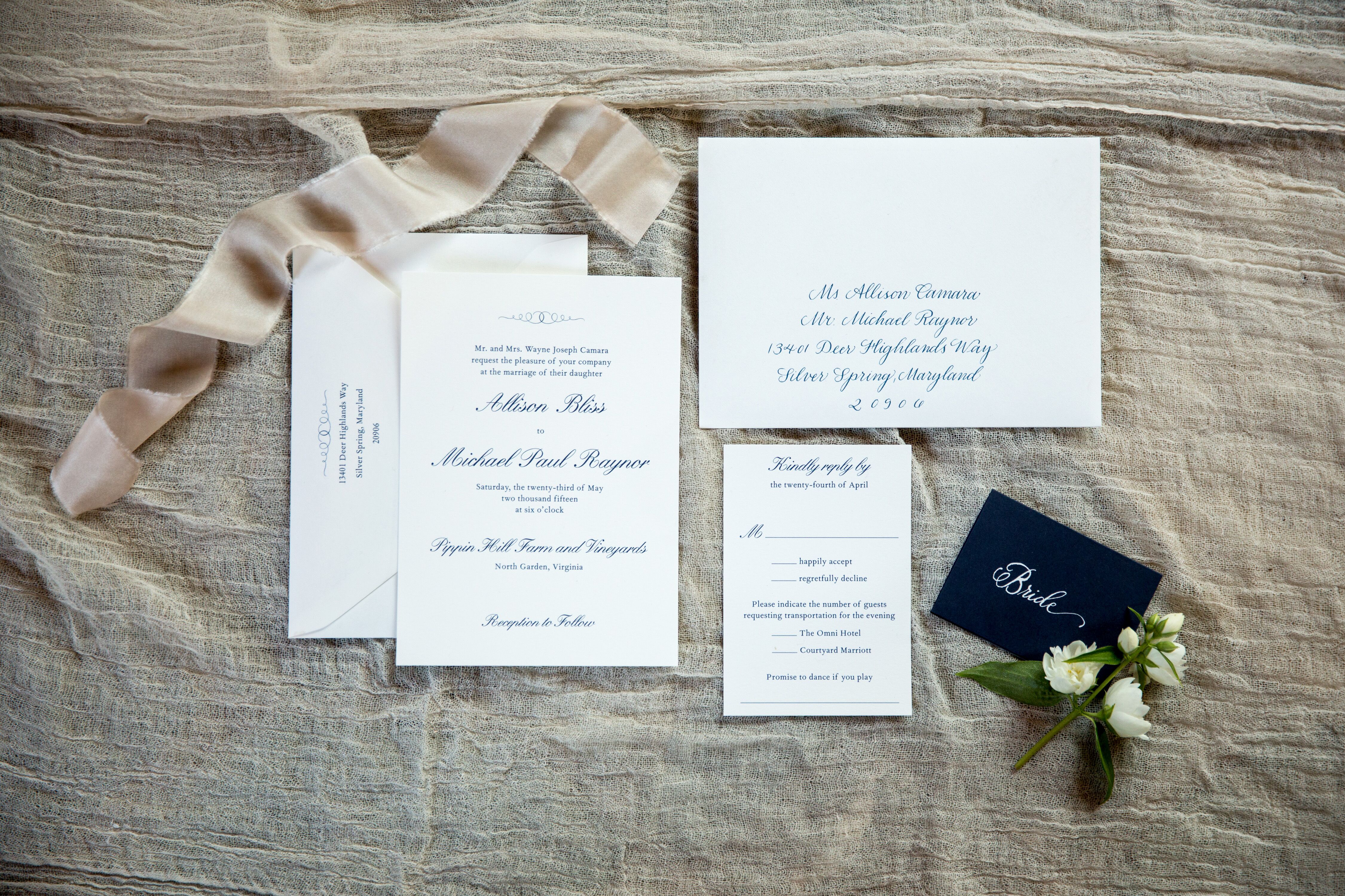 White Wedding Invitations and Blue Calligraphy