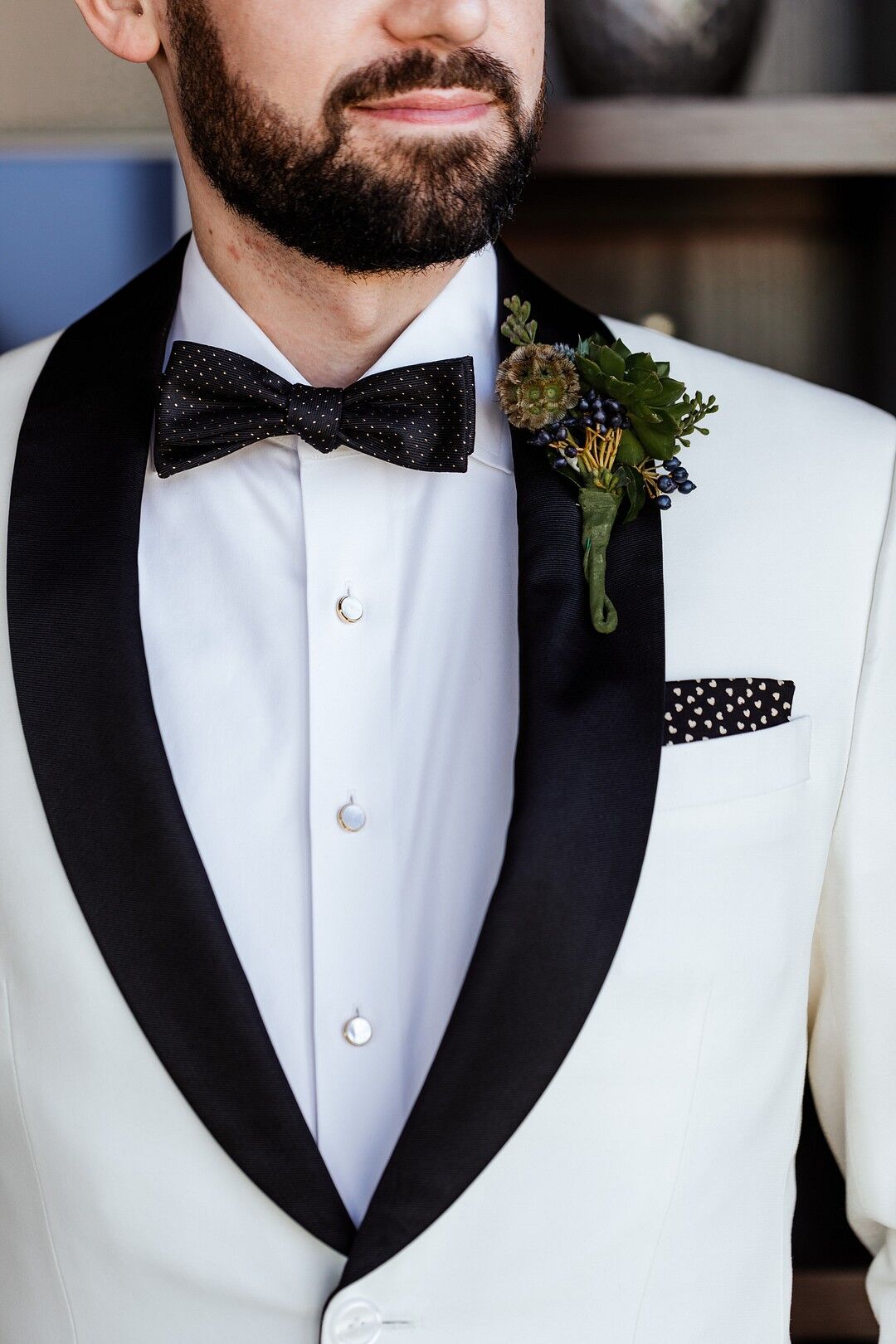 Modern Groom with White Tuxedo Jacket, Boutonniere and Bow Tie