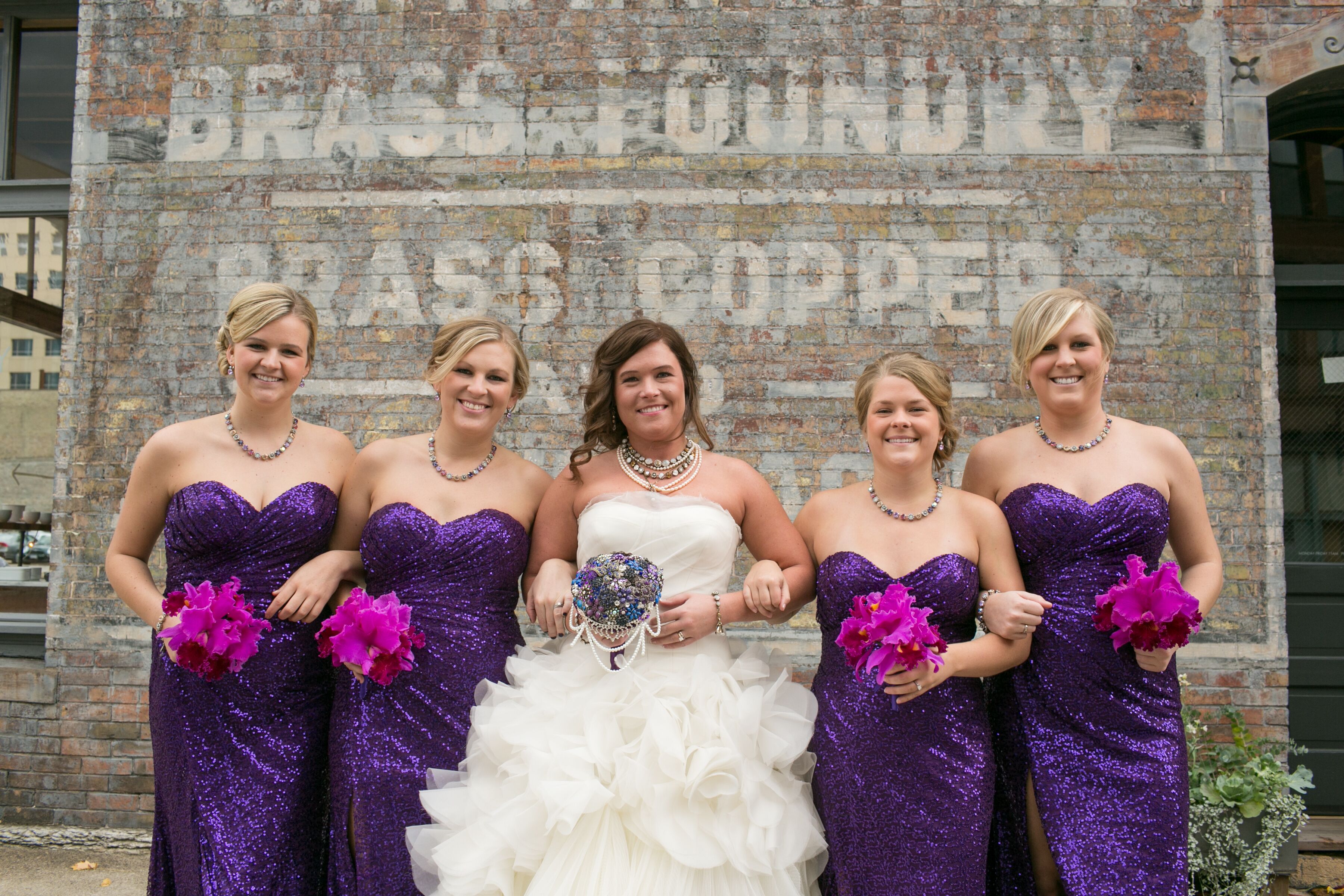 Purple Sequin Bridesmaid Dresses with Orchid Bouquets