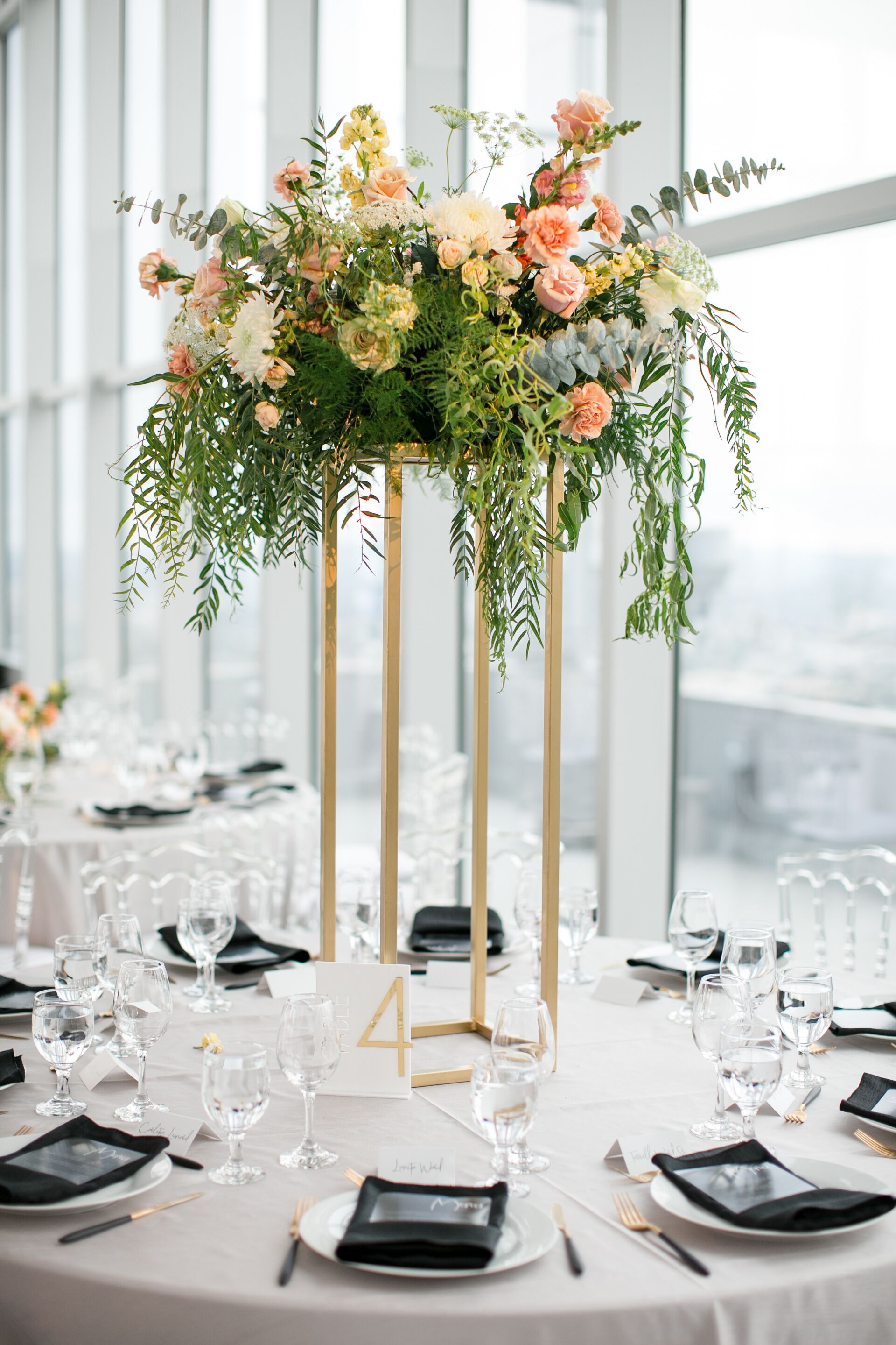 Round Tables With Elegant Tall Centerpieces