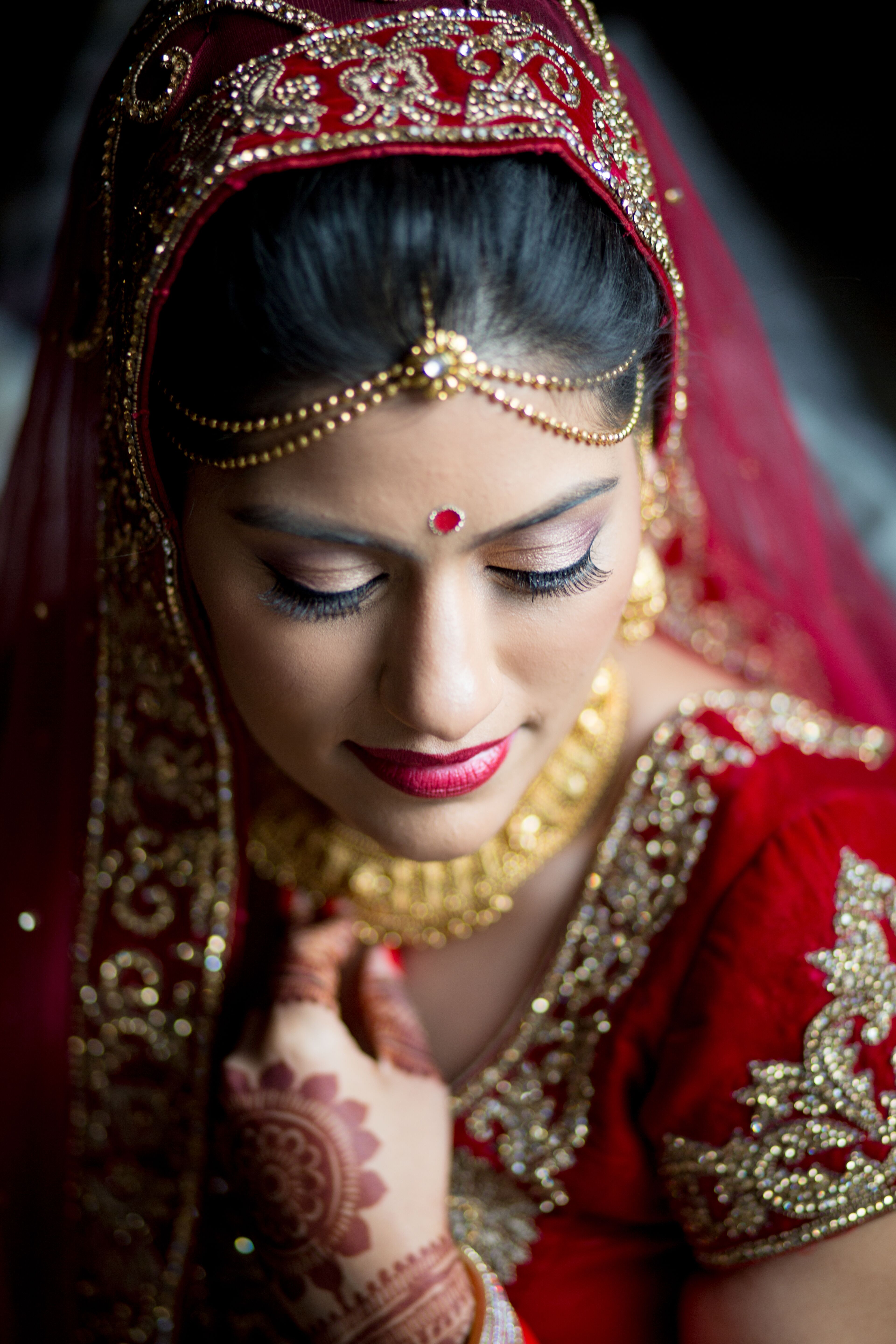 Indian Bride In Traditional Red And Gold Wedding Sari 