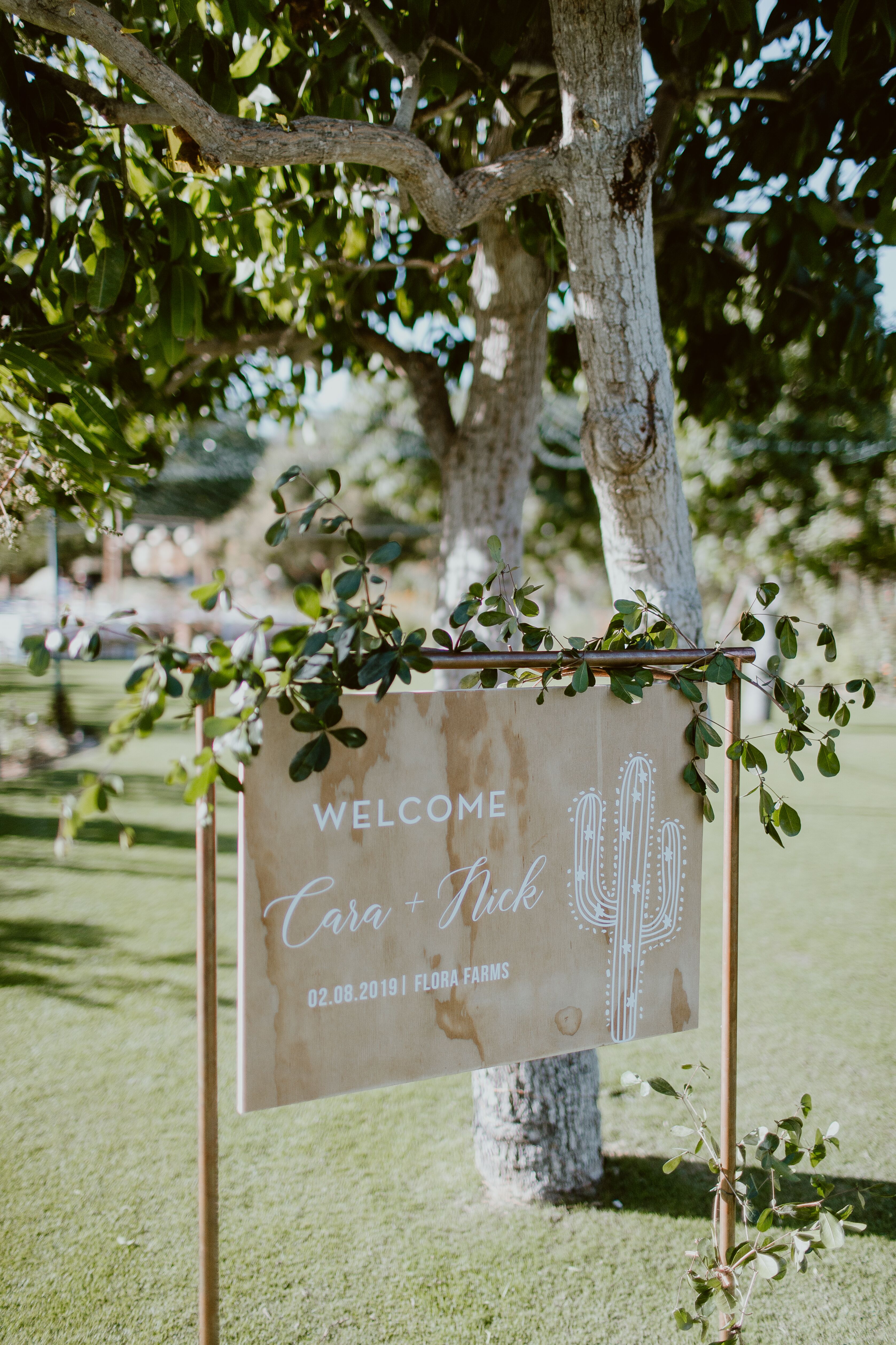 Modern Ceremony Sign with Wooden Frame and Greenery