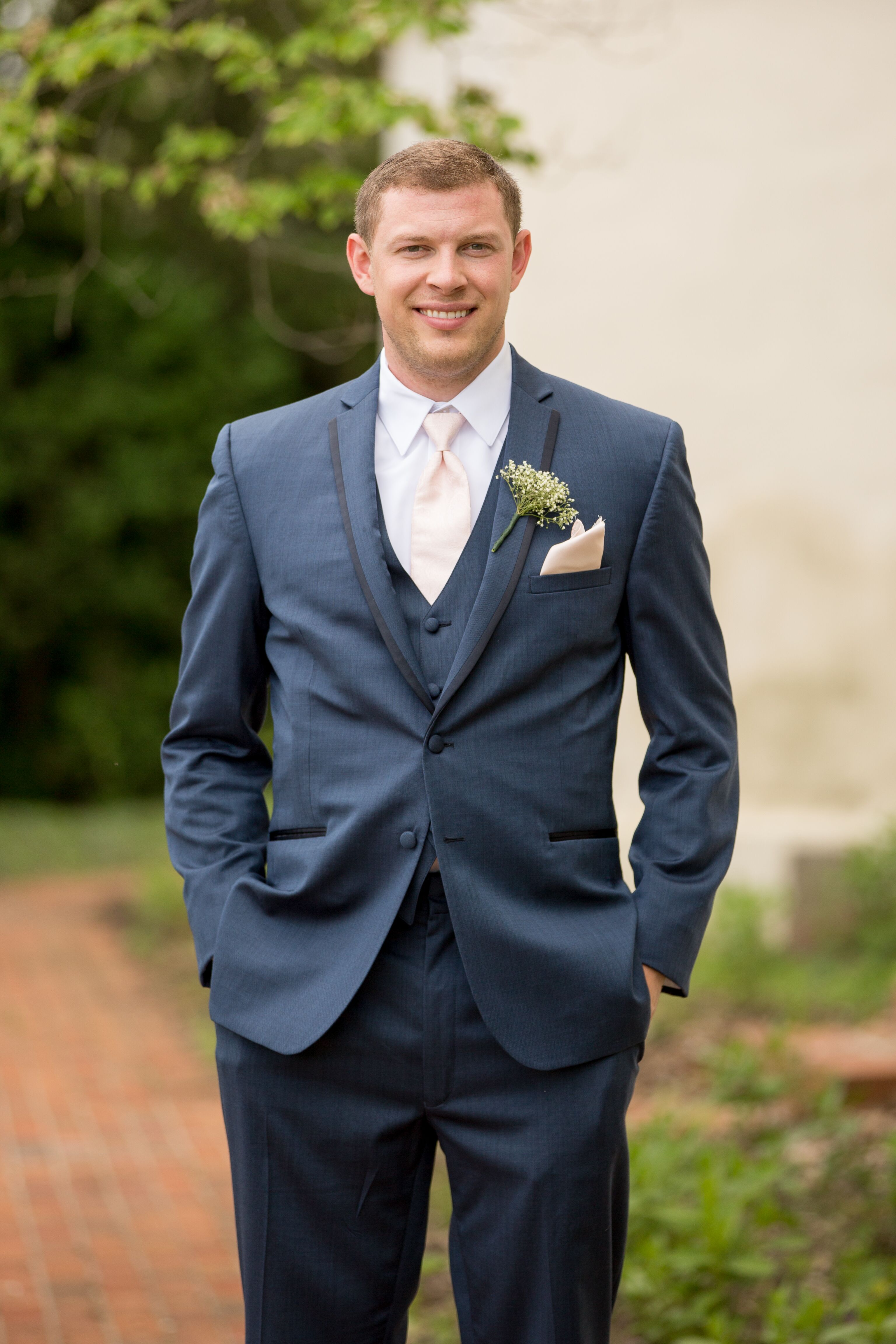 blue suit with peach shirt