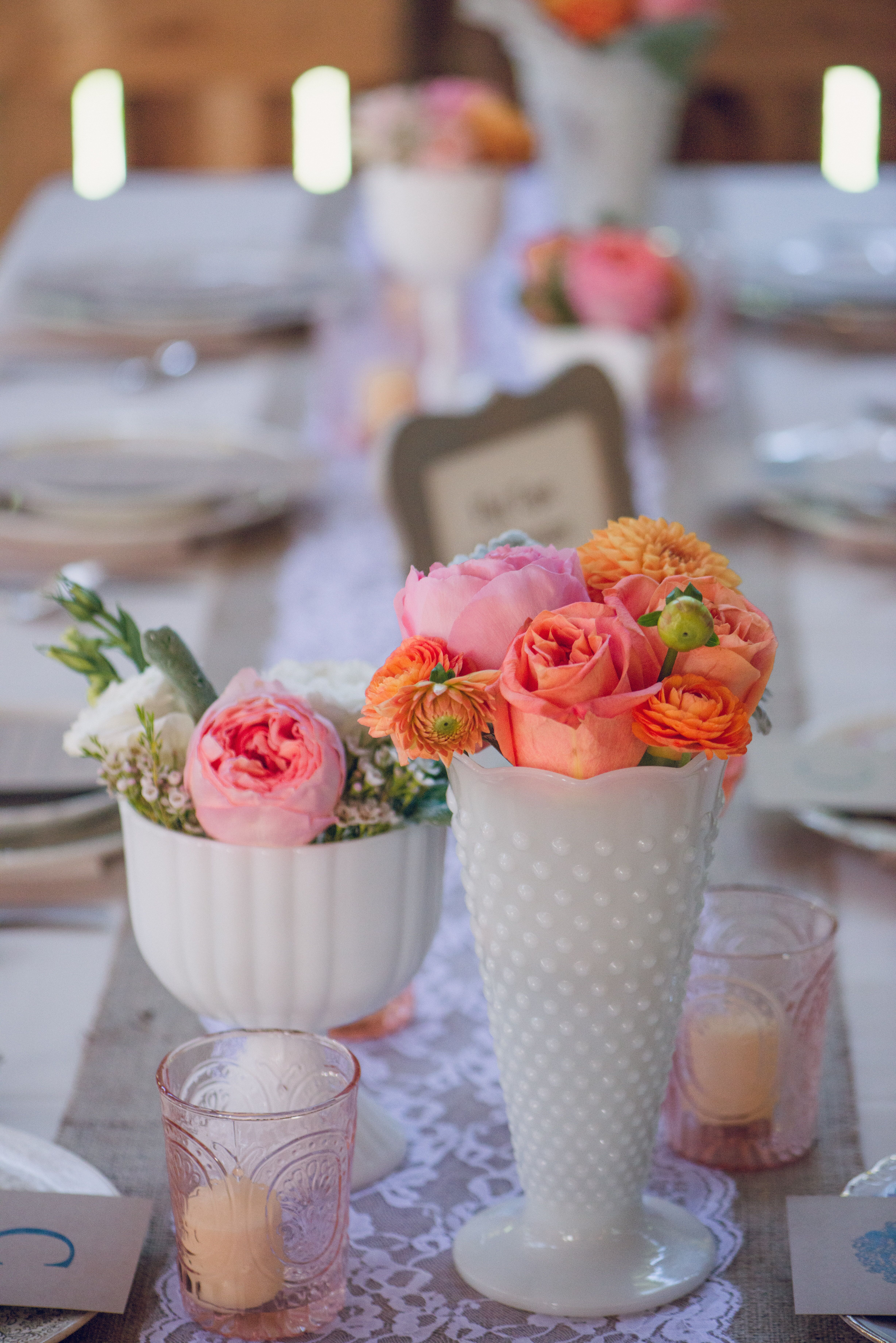 Coral Centerpieces in Mismatched White Vases