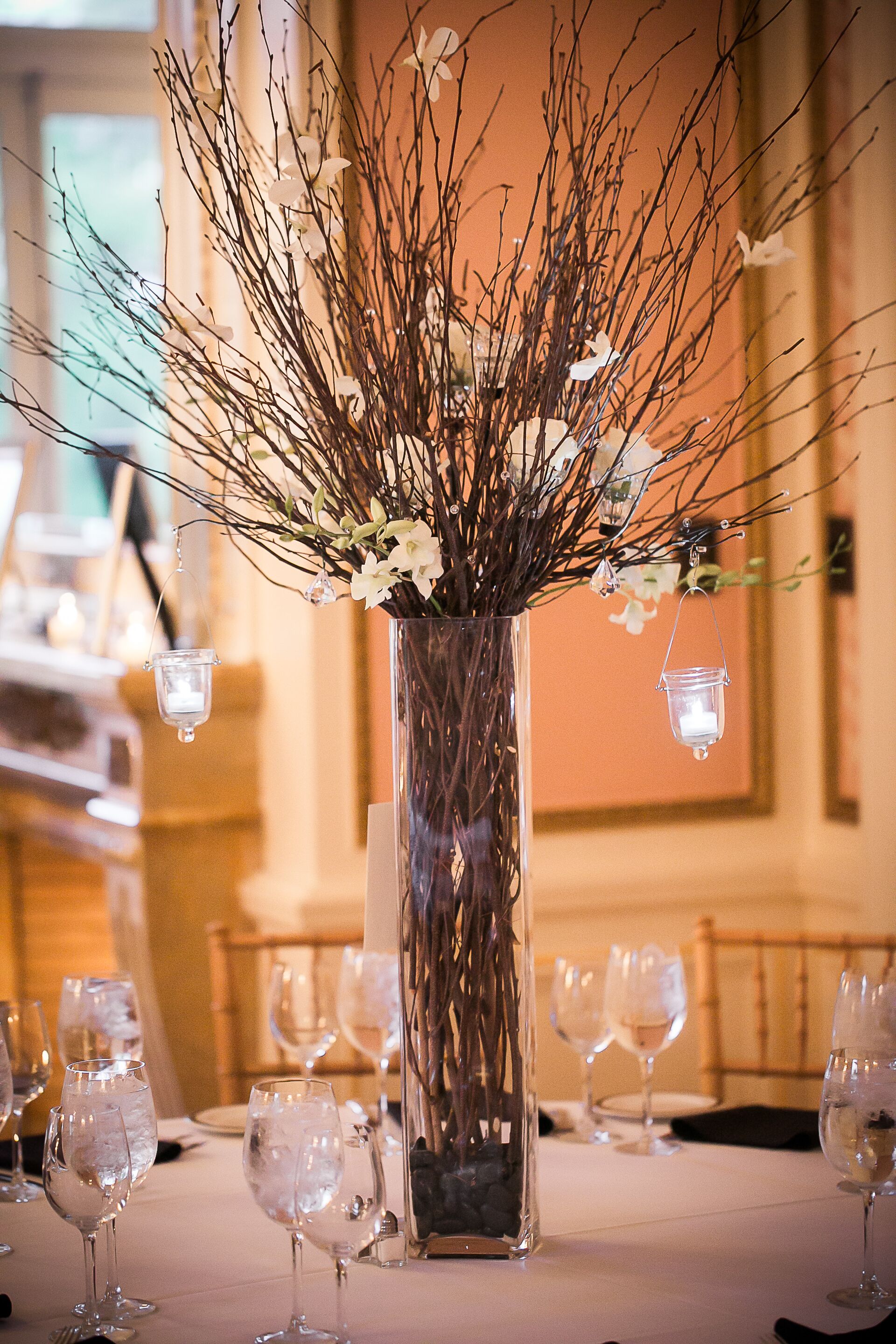 Tall Centerpieces with Branches and White Flowers