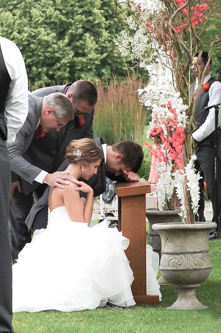 Bride And Groom Praying At Christian Ceremony 1576