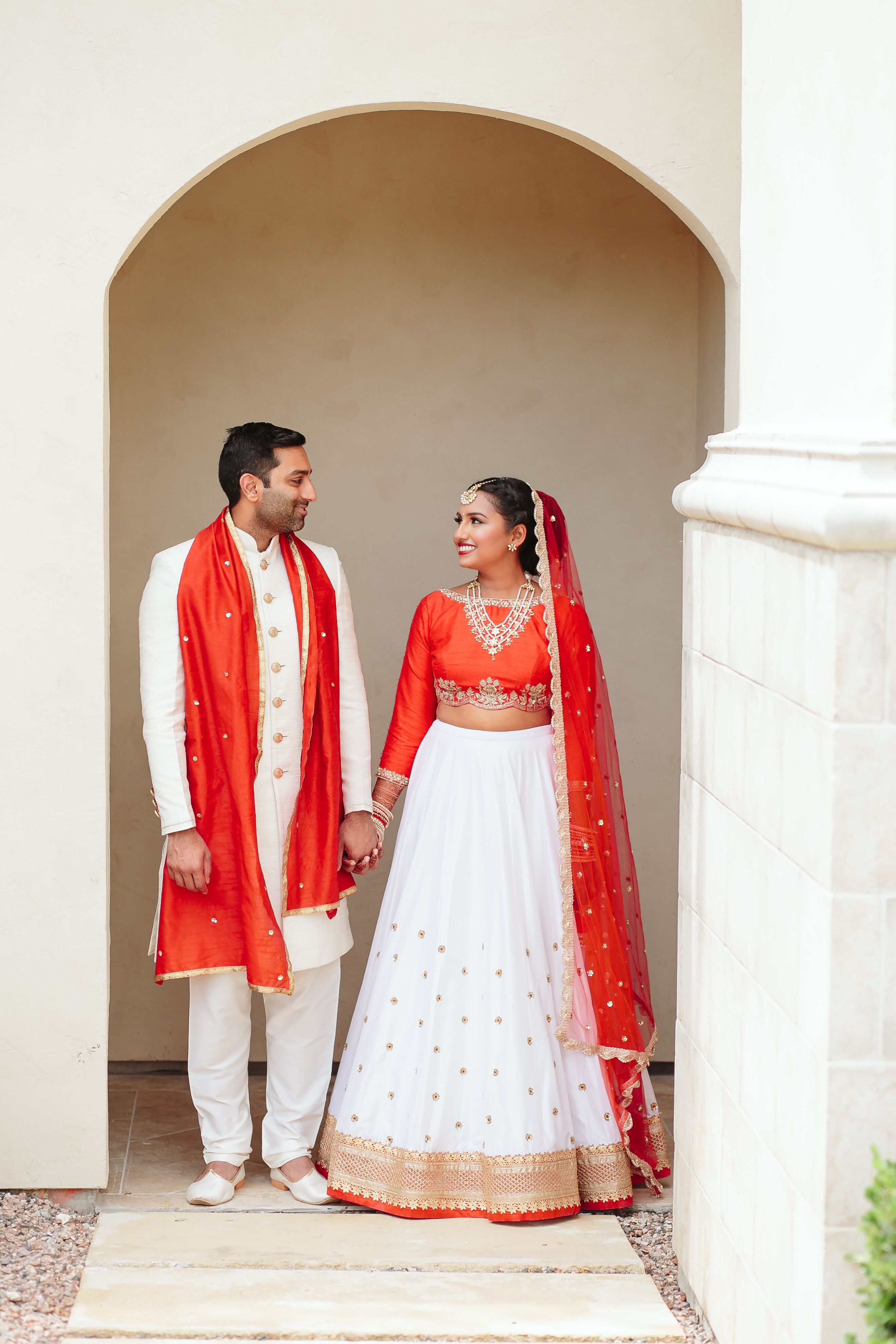 Traditional Indian Couple Dressed in Red and White