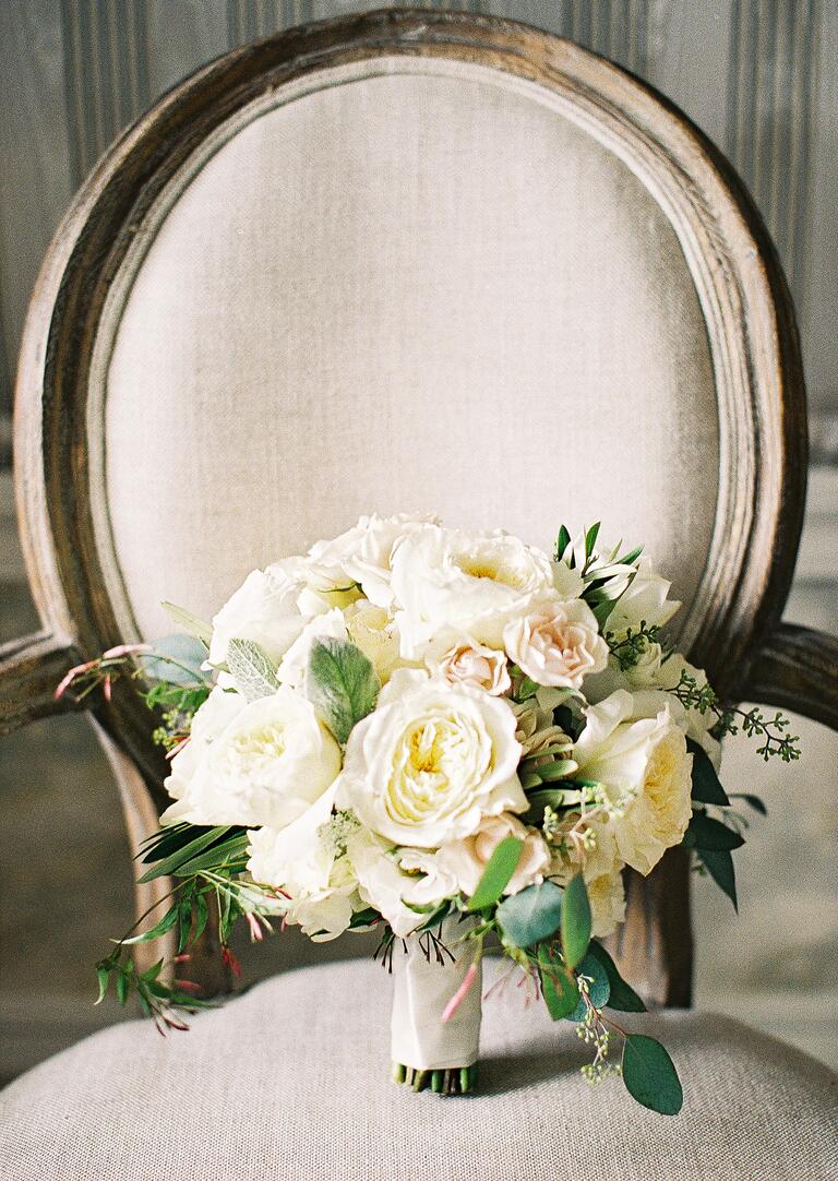 White bridal bouquet on armchair
