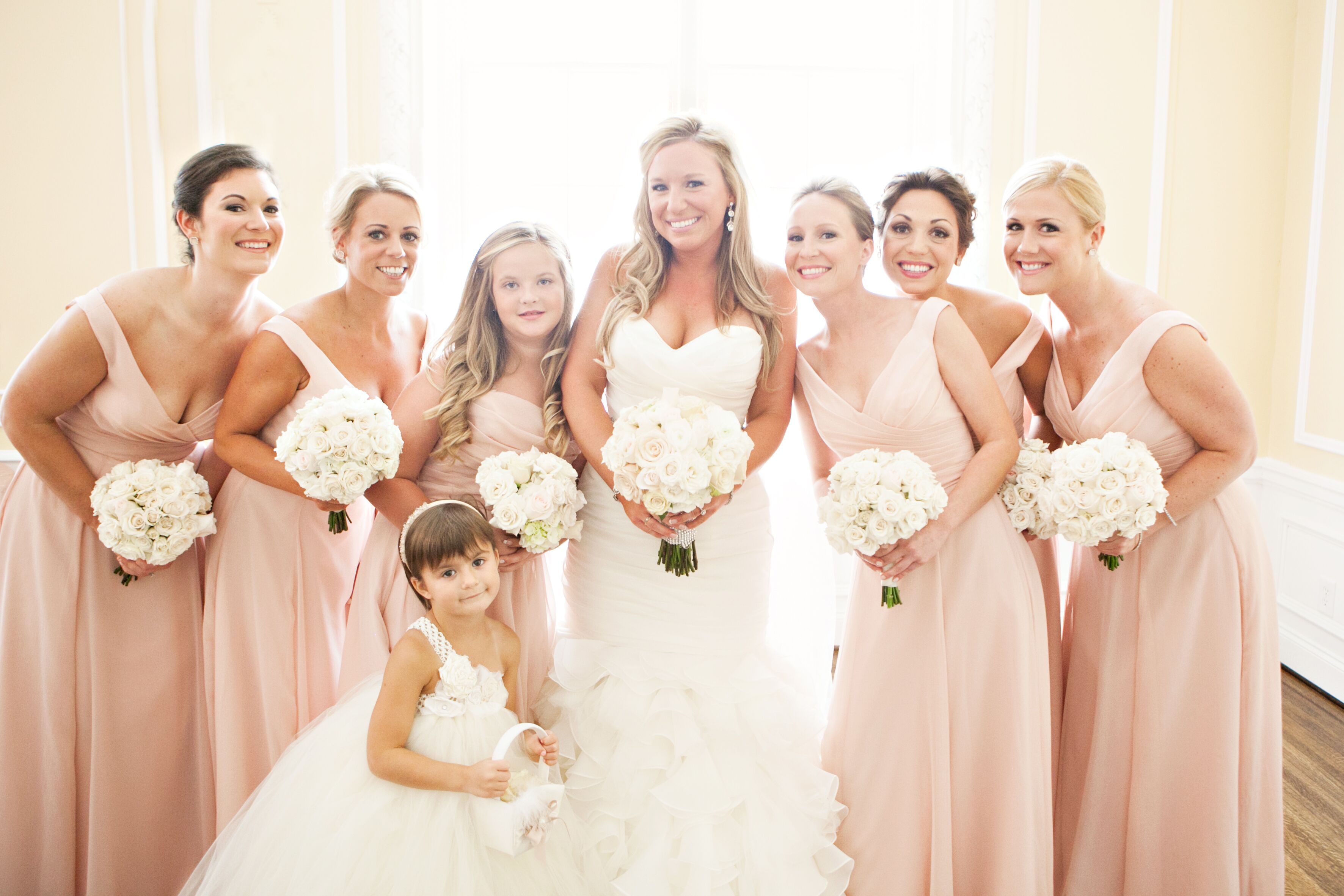 Bridesmaids in Blush With White Bouquets at Ballroom Wedding