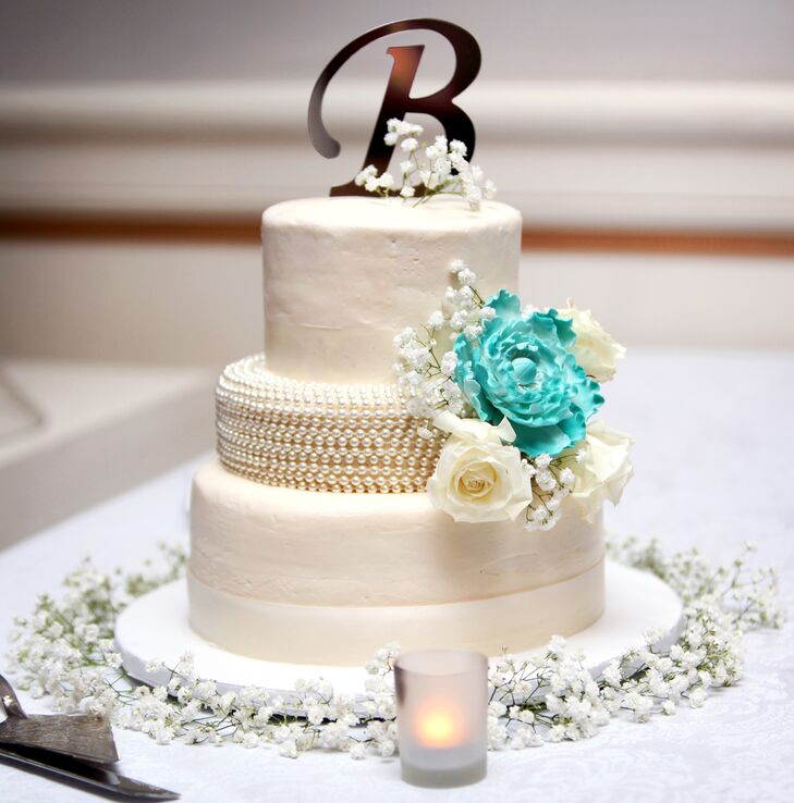 White Wedding Cake With Teal Cake Flower