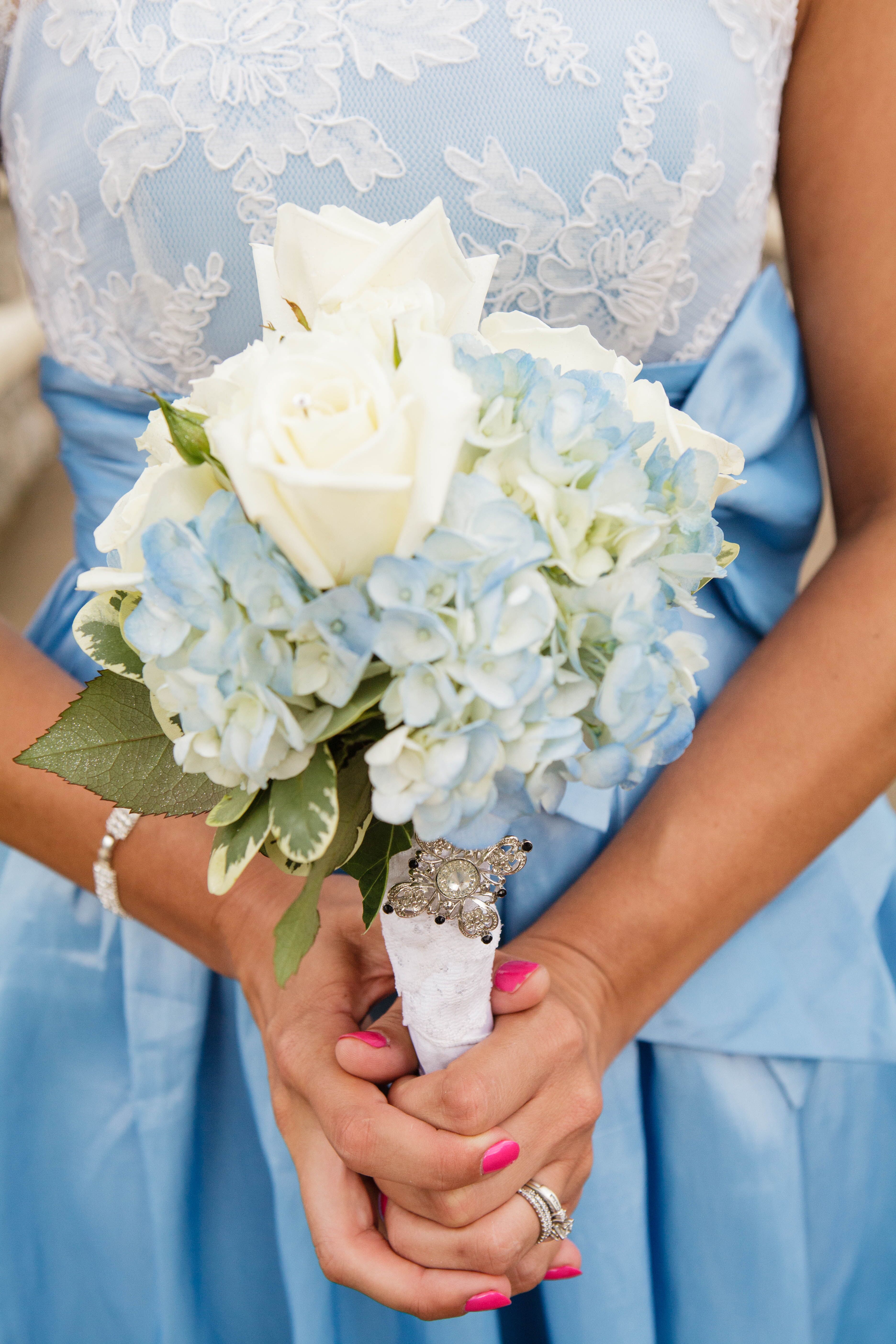 blue hydrangea and white rose boutonniere