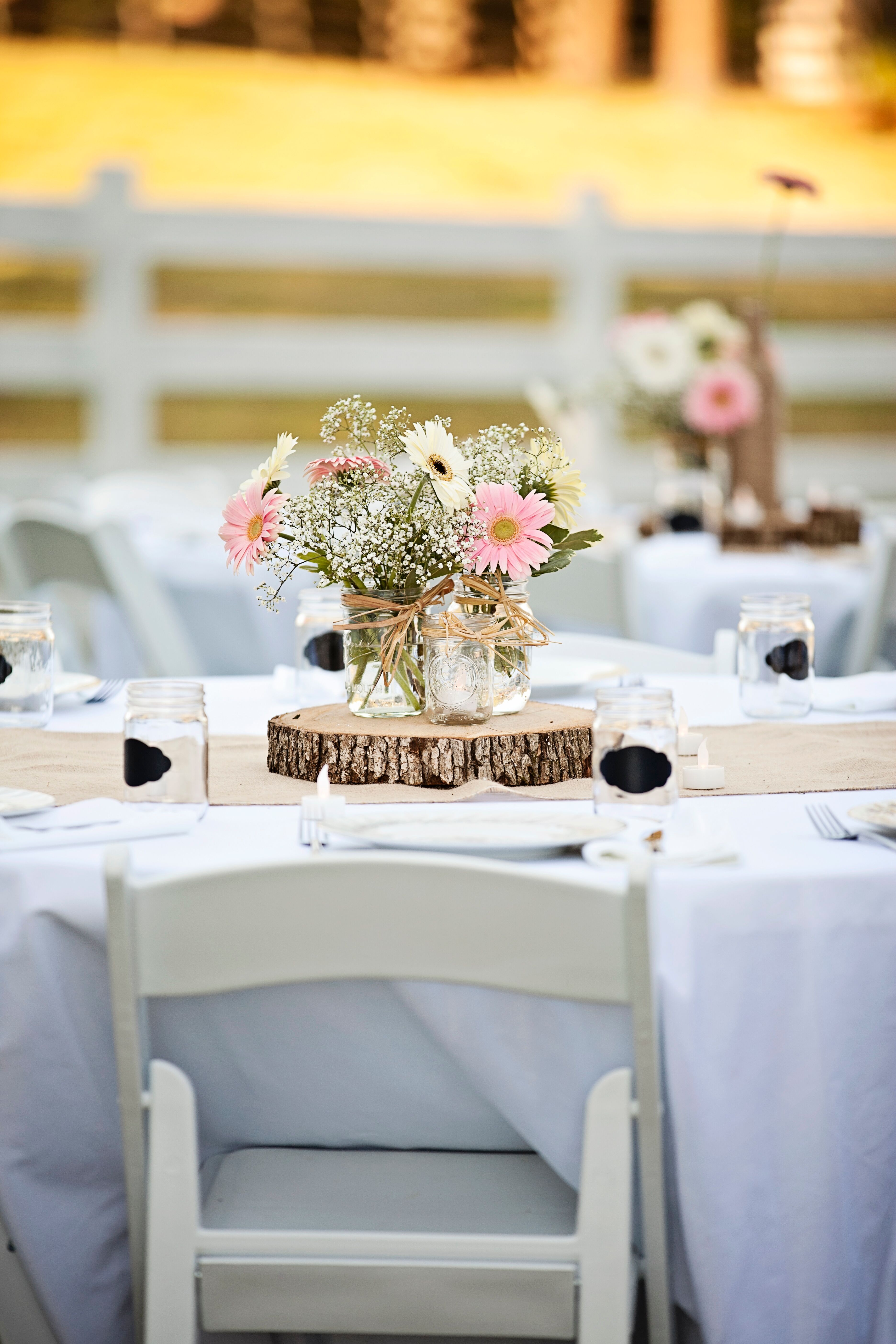 Rustic Wild Flower Centerpieces on Wood Rounds