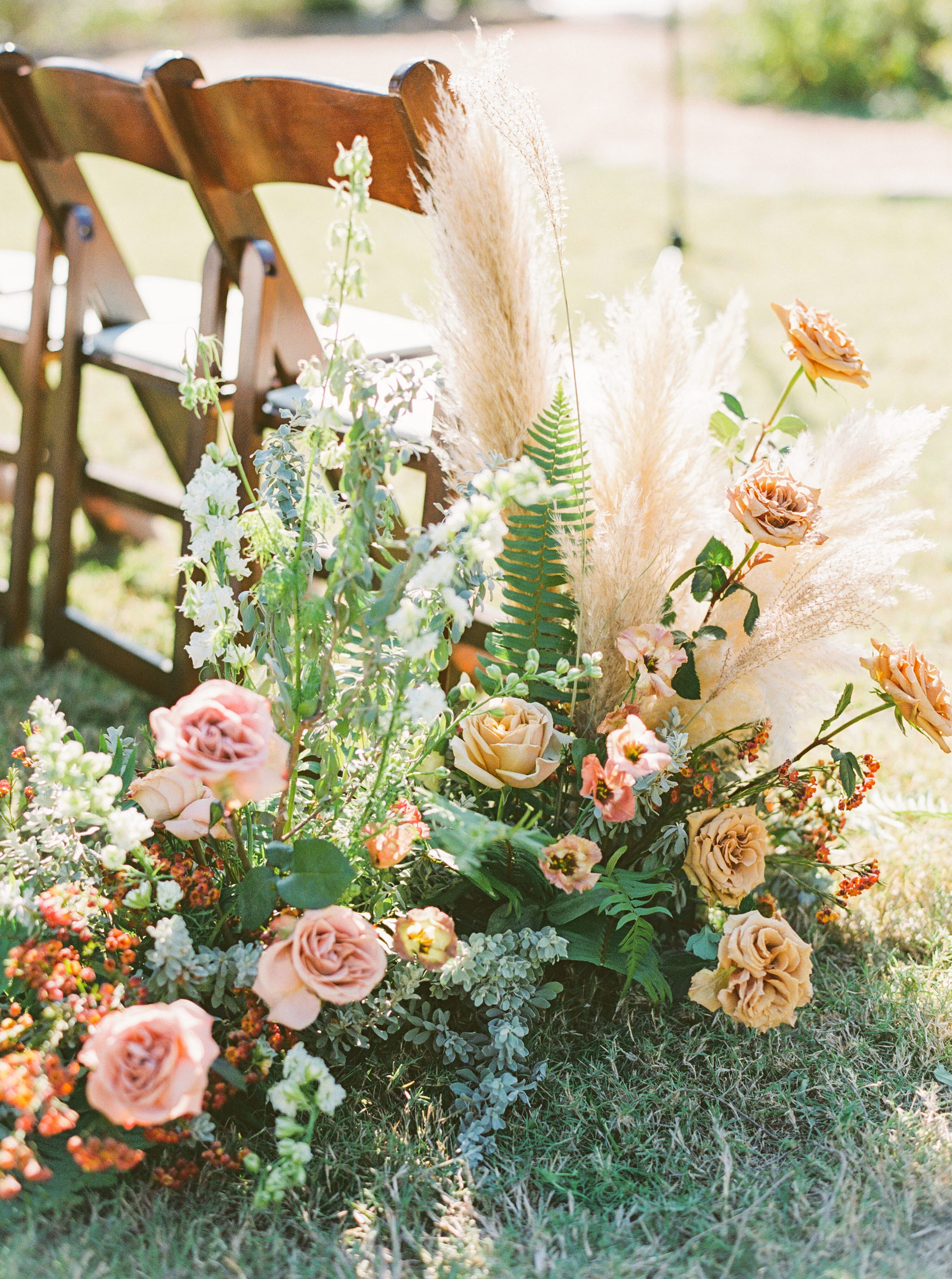 Boho Aisle Arrangements for Ceremony at The Greenhouse at Driftwood