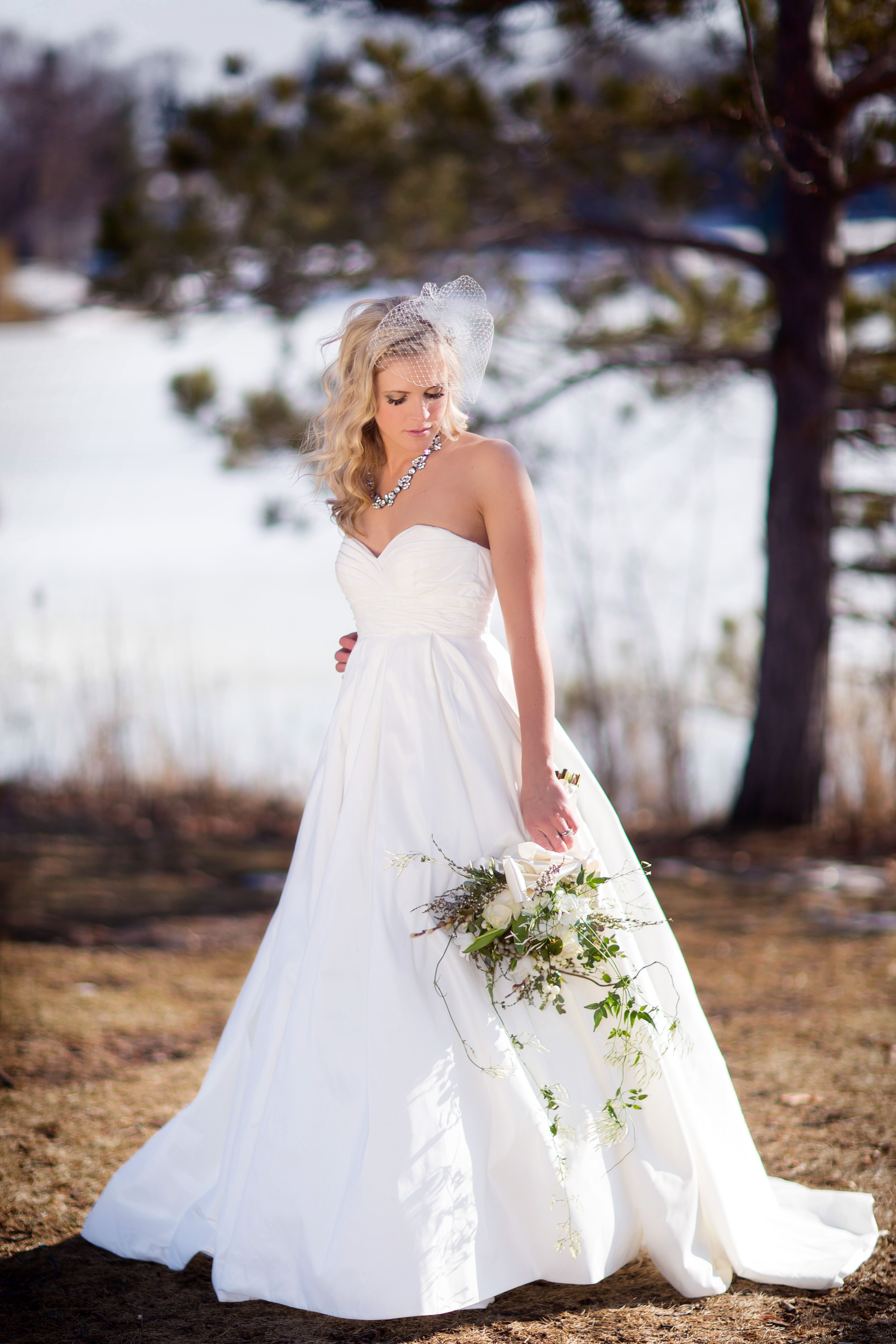 Bride in Strapless A Line Wedding Dress with Down Hairstyle and