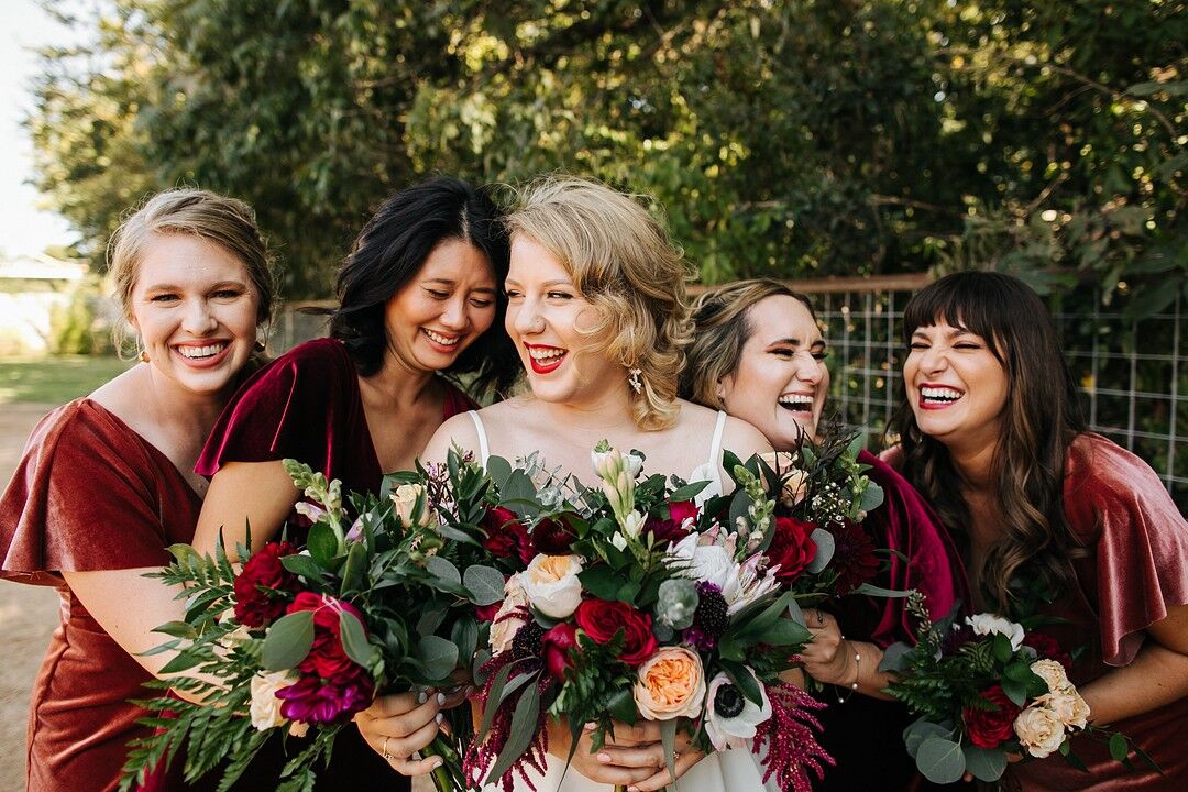 Bridesmaids with Modern Bouquets and Red Velvet Dresses