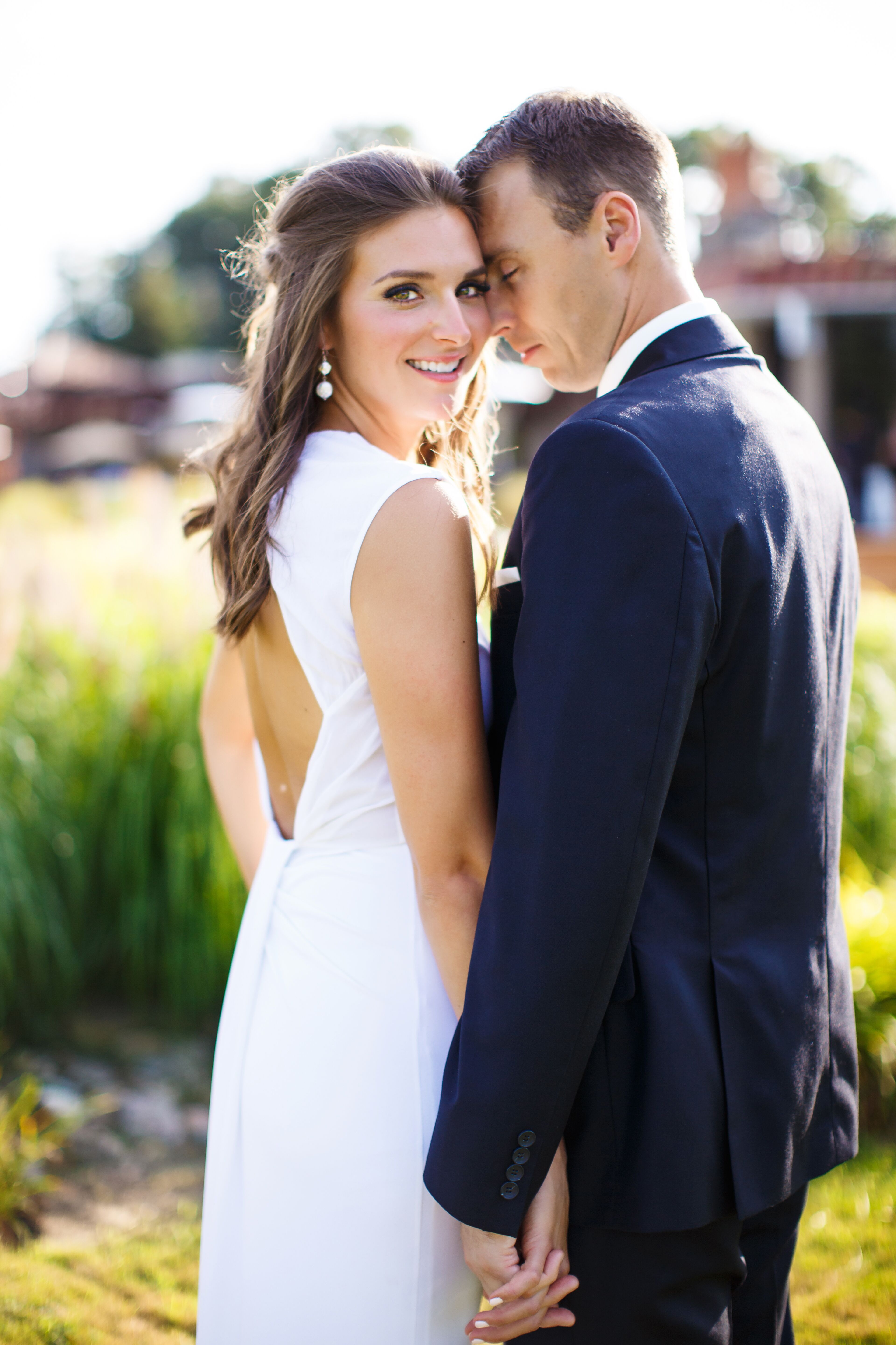 Bride in Dress With Keyhole Back and Groom in Navy Suit