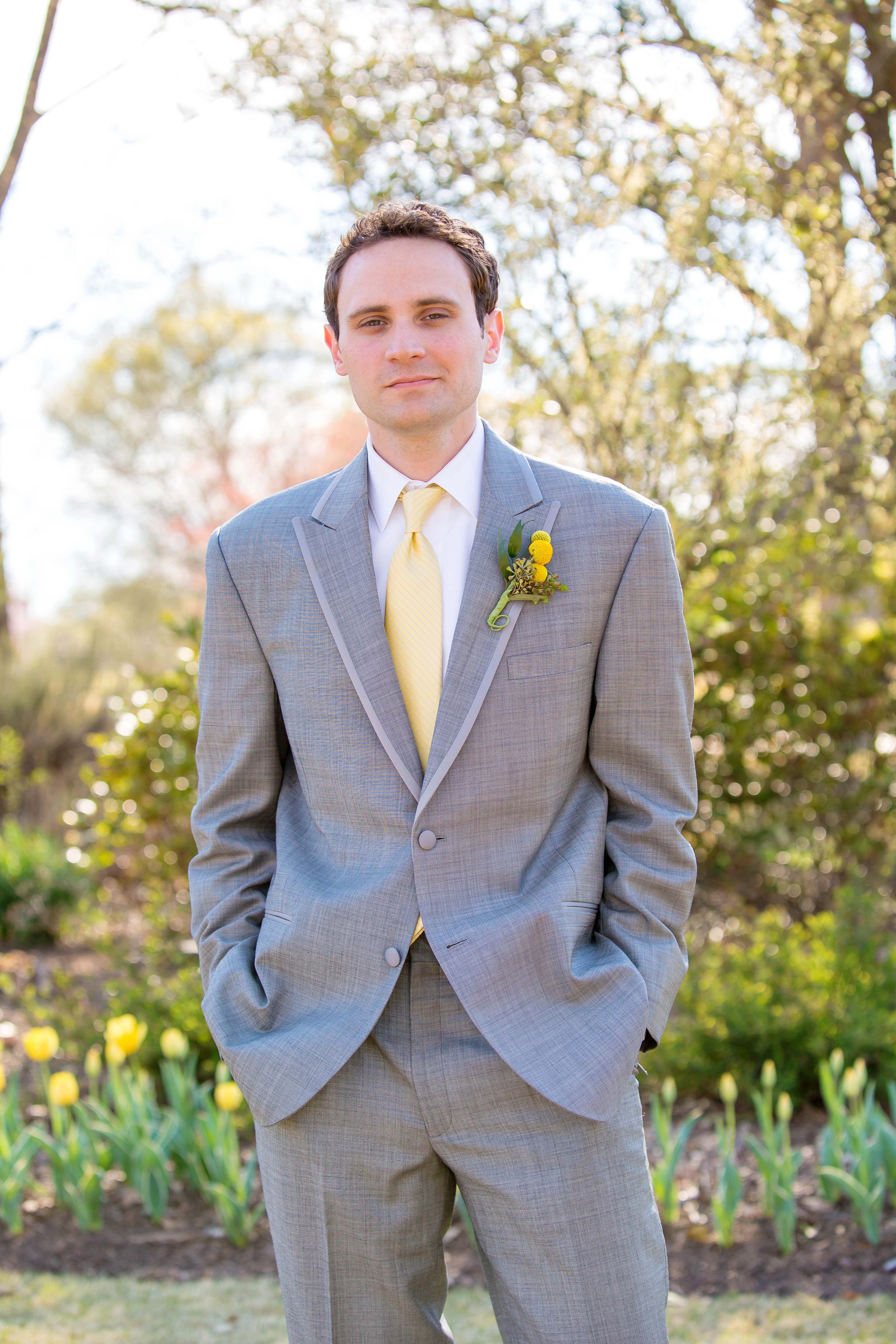 grey suit white shirt yellow tie