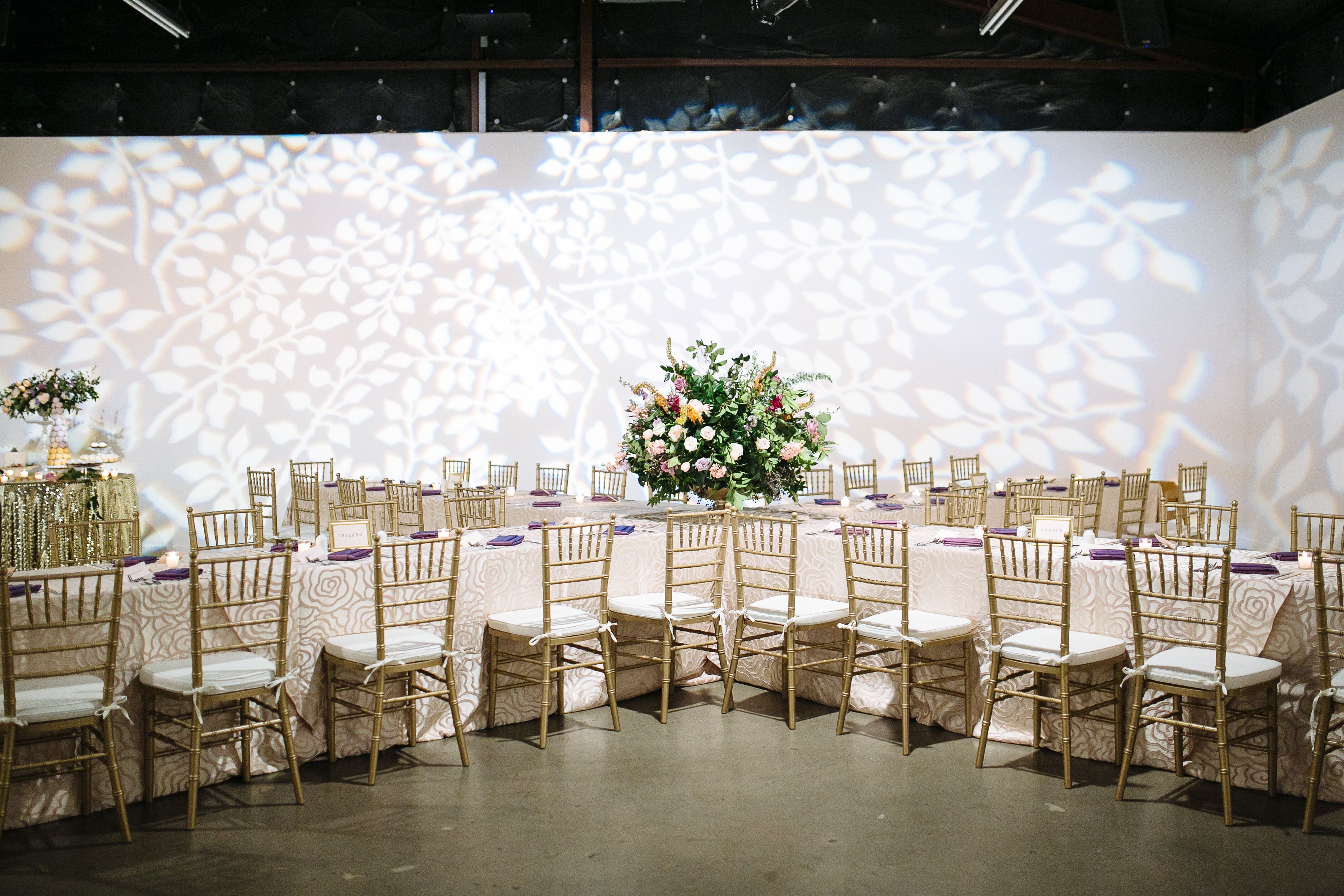 X-Shaped Banquet Tables and Gold Chiavari Chairs