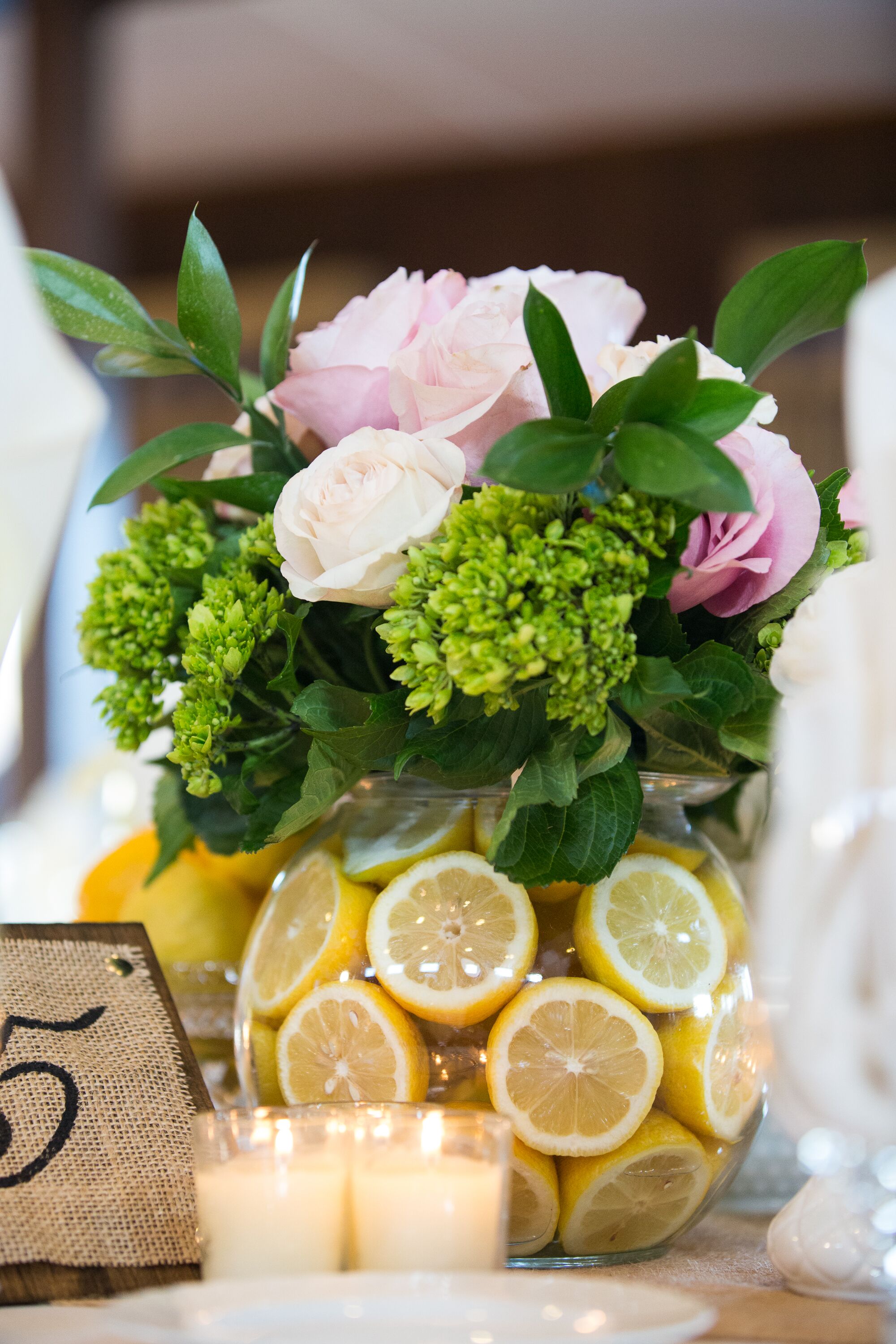 Green and Pink Rose Centerpieces in Yellow Lemon Vases