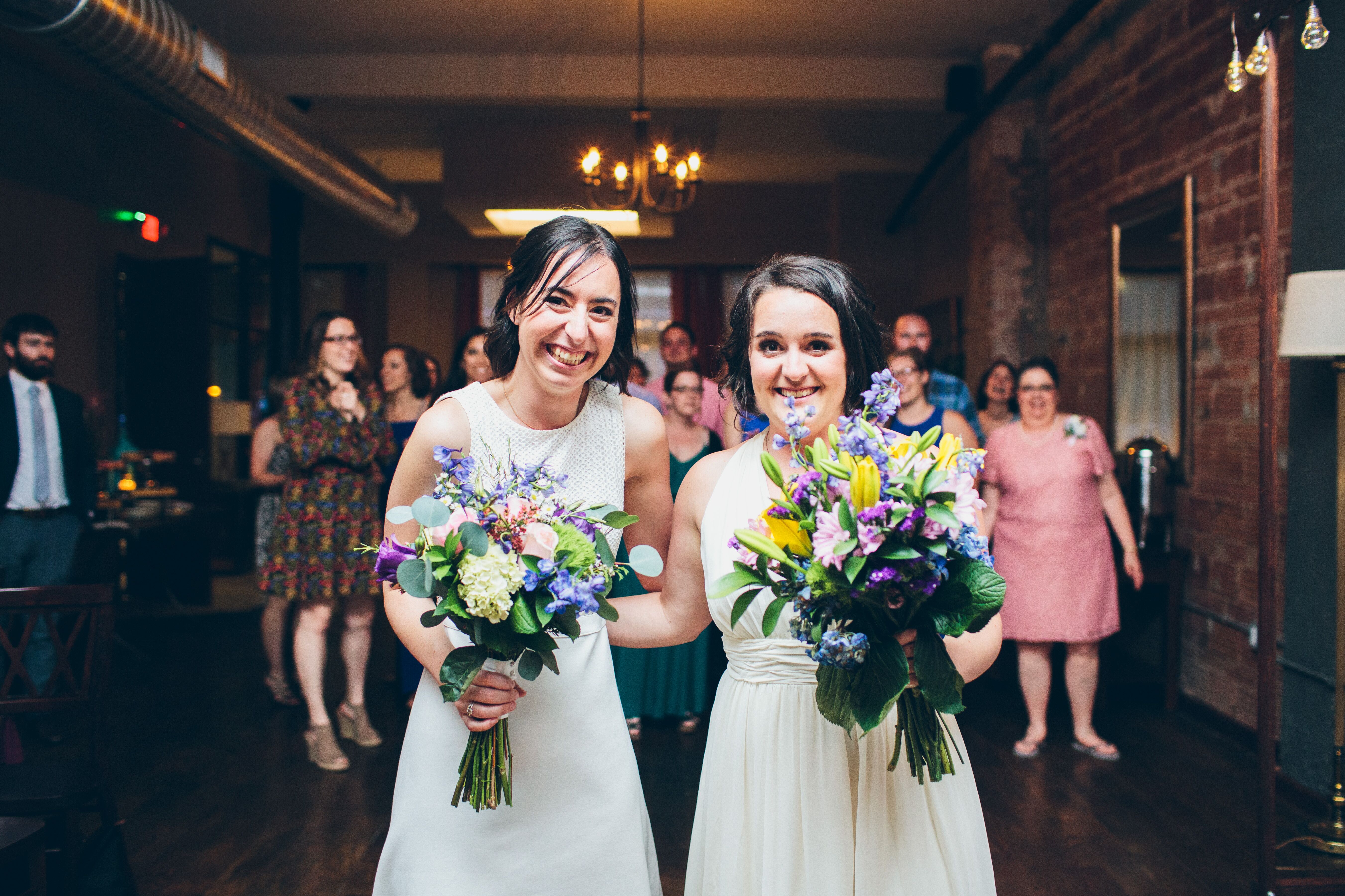 Brides with Complementary Dresses and Bouquets