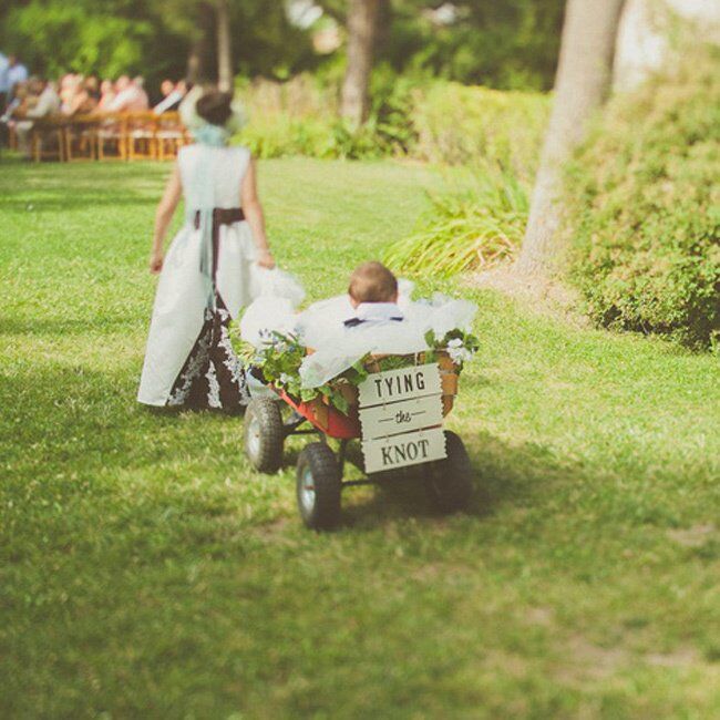 The ring bearer was the bride and groom’s eight month old son who was pulle...