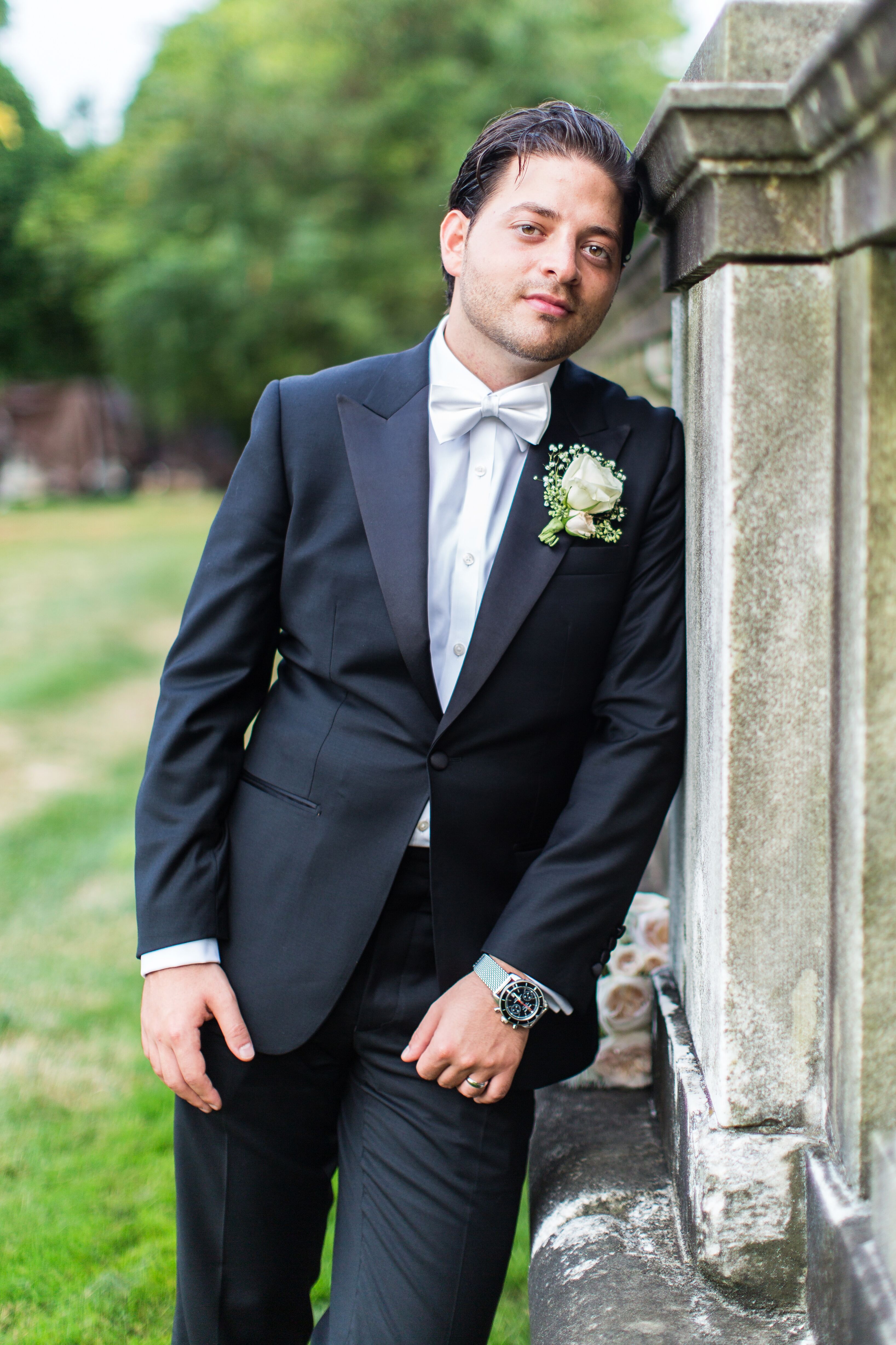 Grooms Slim Fit Tuxedo with White Bow Tie and Boutonniere