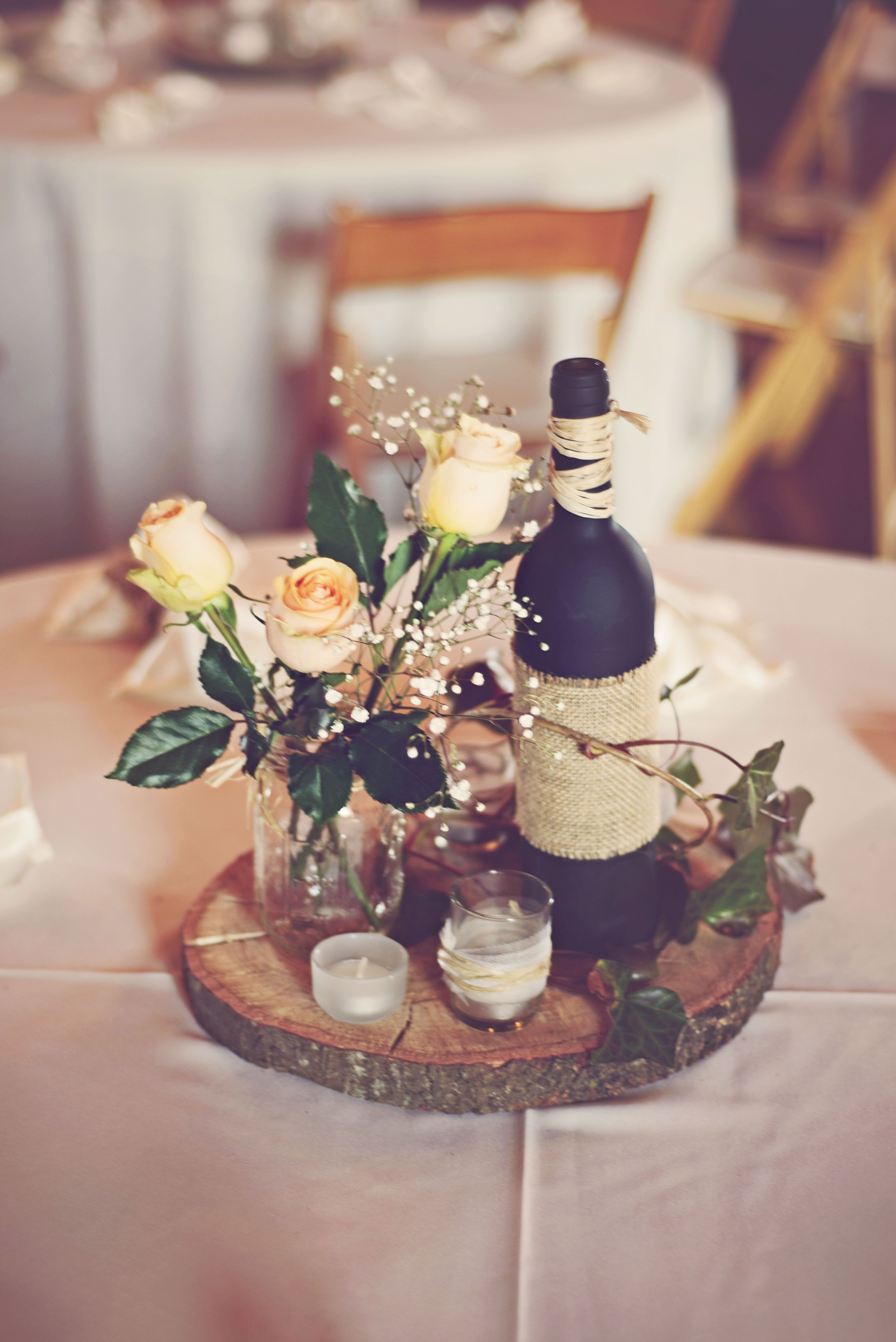 DIY Rustic Centerpiece with Rose Buds and Wood Round