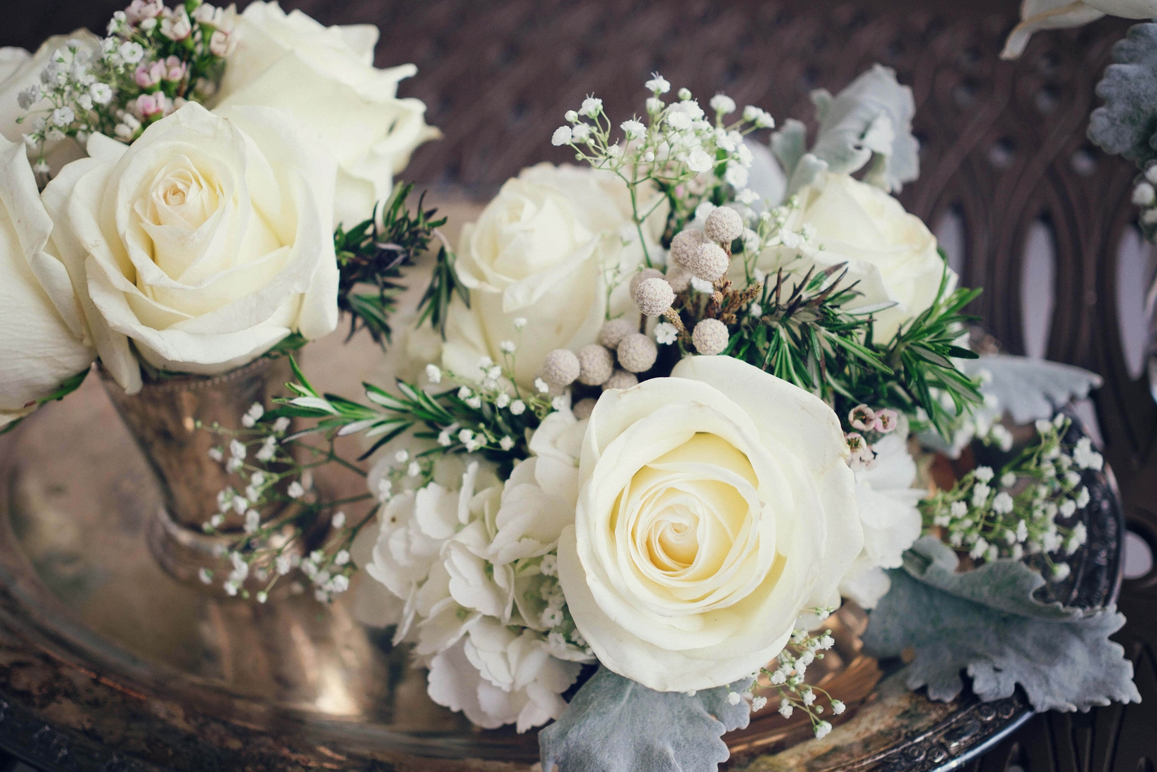 Centerpieces with Roses, Hydrangeas, Baby's Breath and Silver Brunia