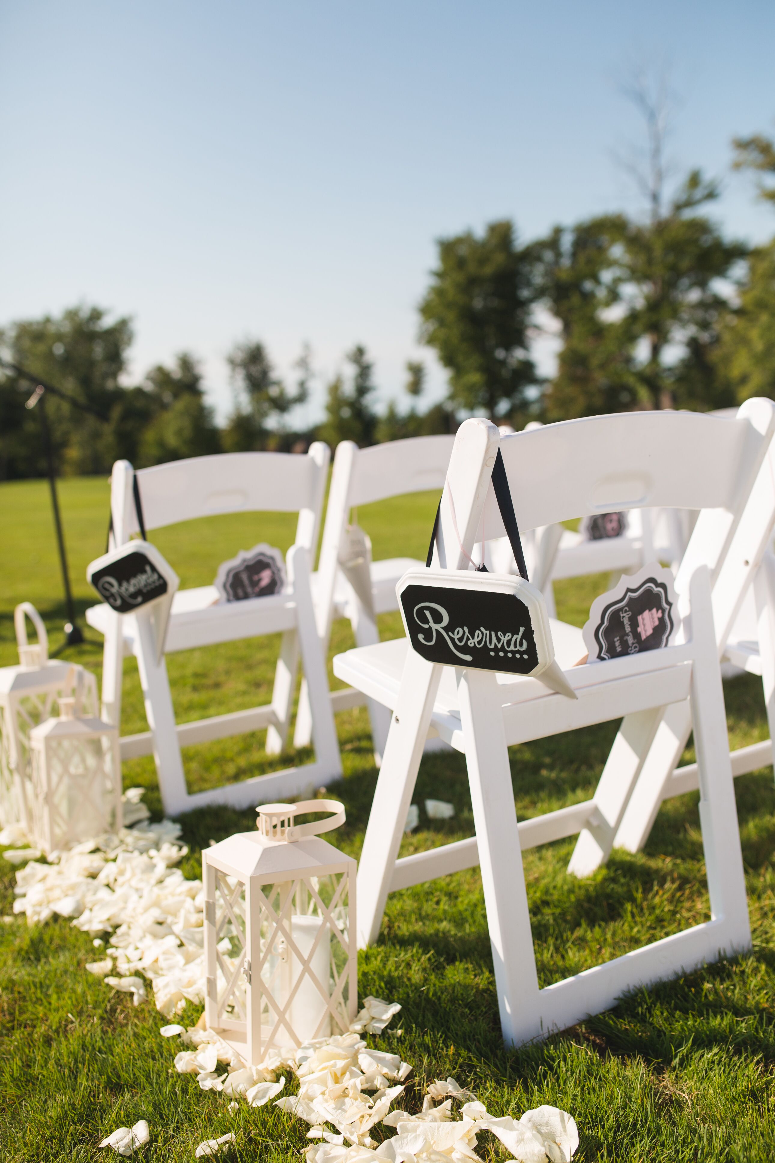 White Chairs and Aisle Decorations