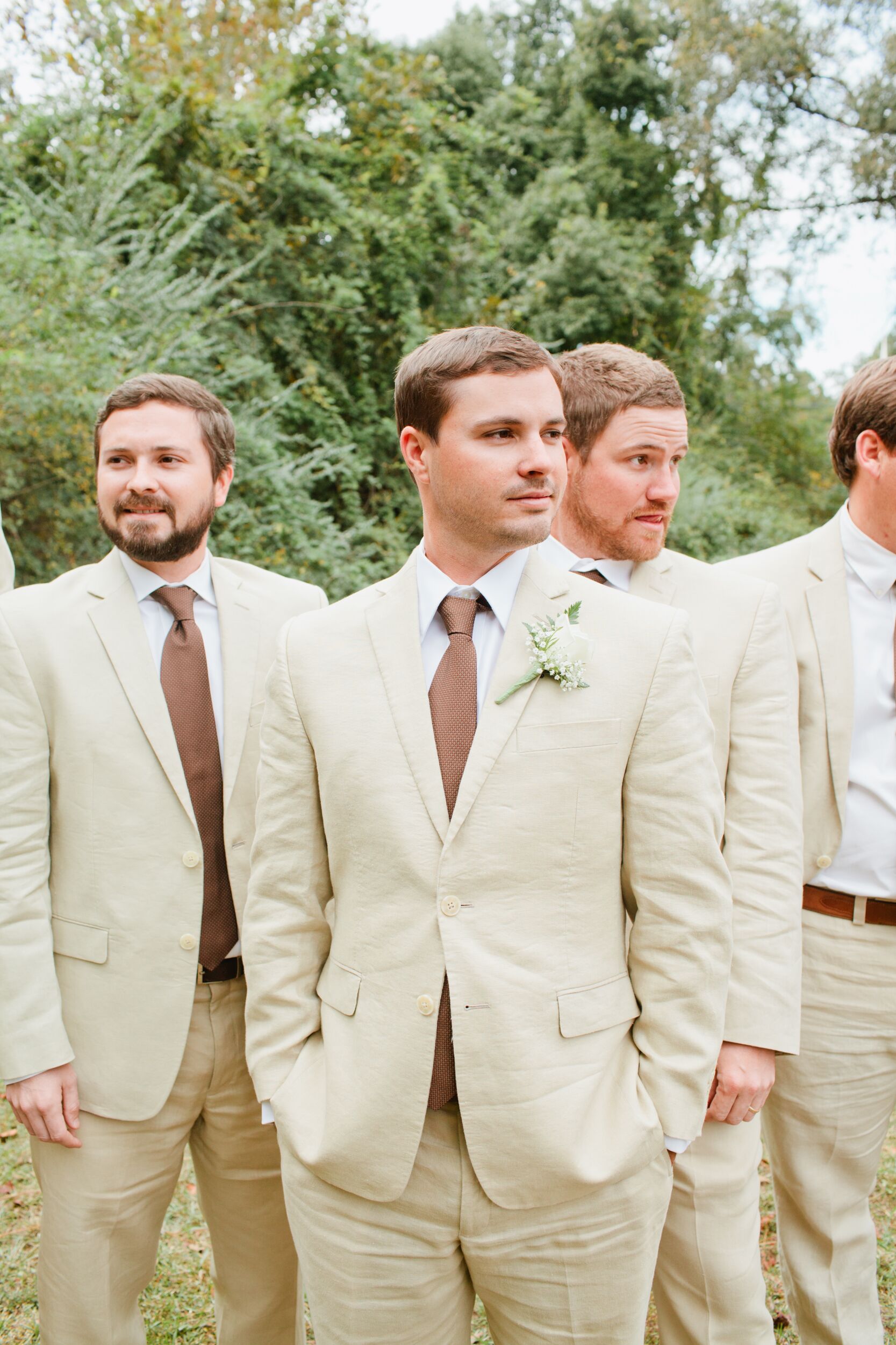 Groomsmen in Tan Tuxes with Mauve Ties