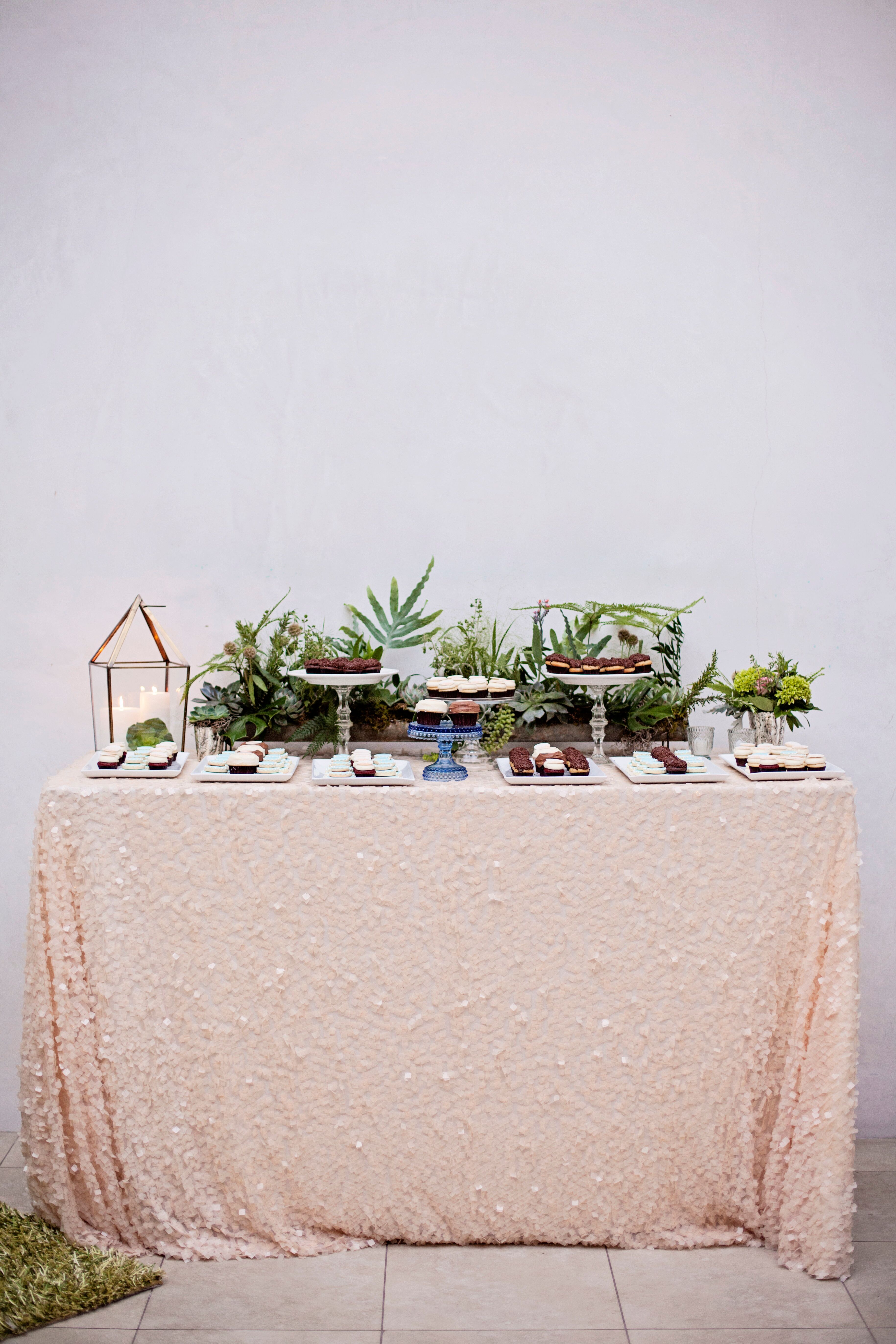 Dessert Display with Lush Greenery and Glittery Table Linens