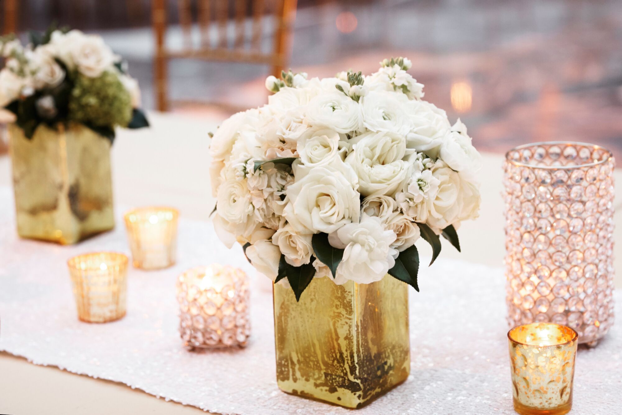 White Flowers In Gold Vase