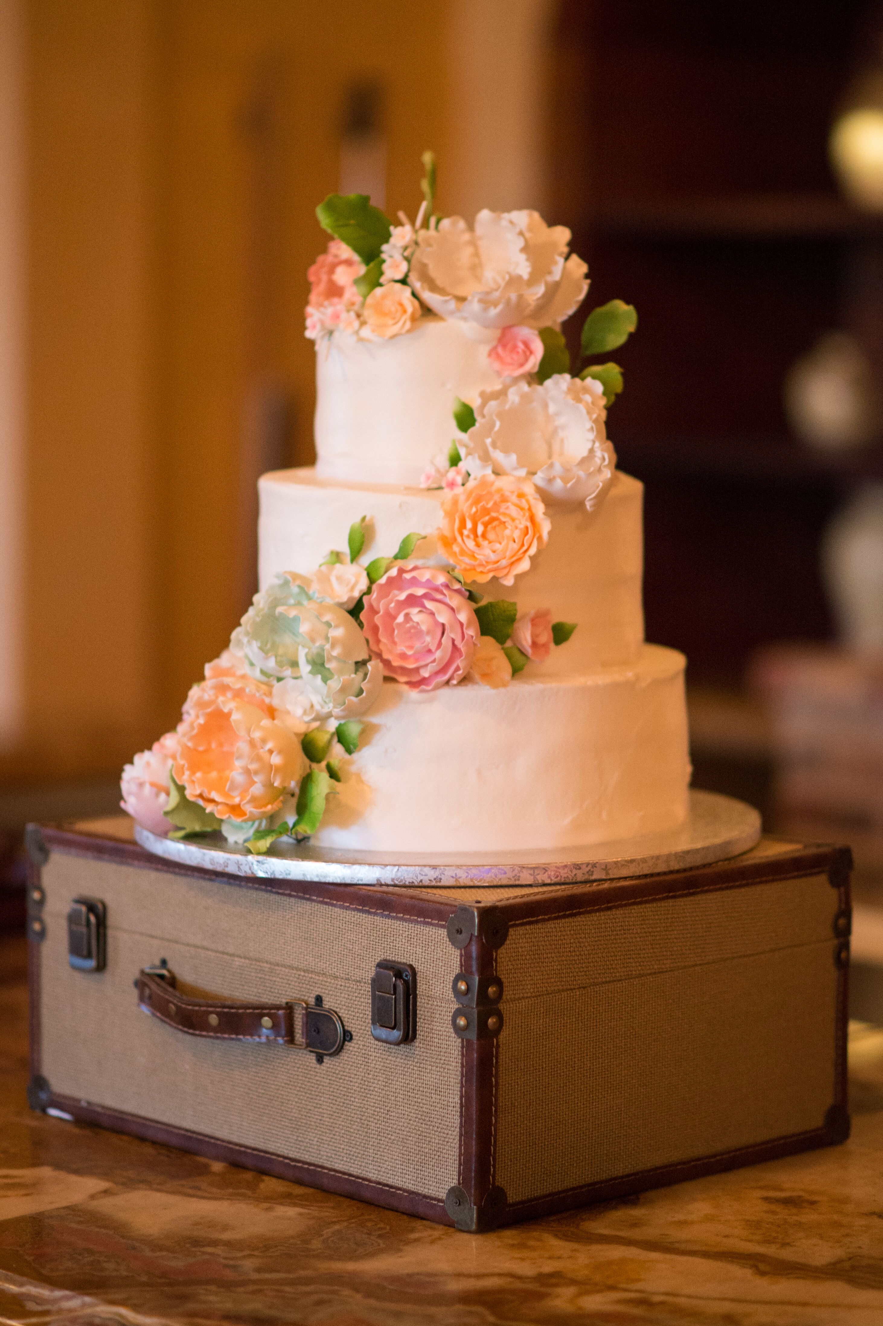 Wedding Cake with Cascading Flowers on Trunk