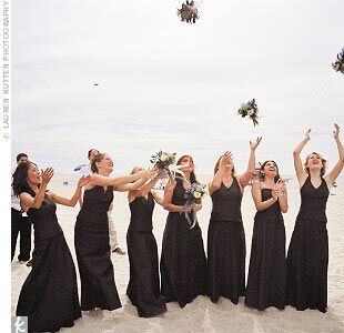 Beach wedding with black bridesmaid dresses