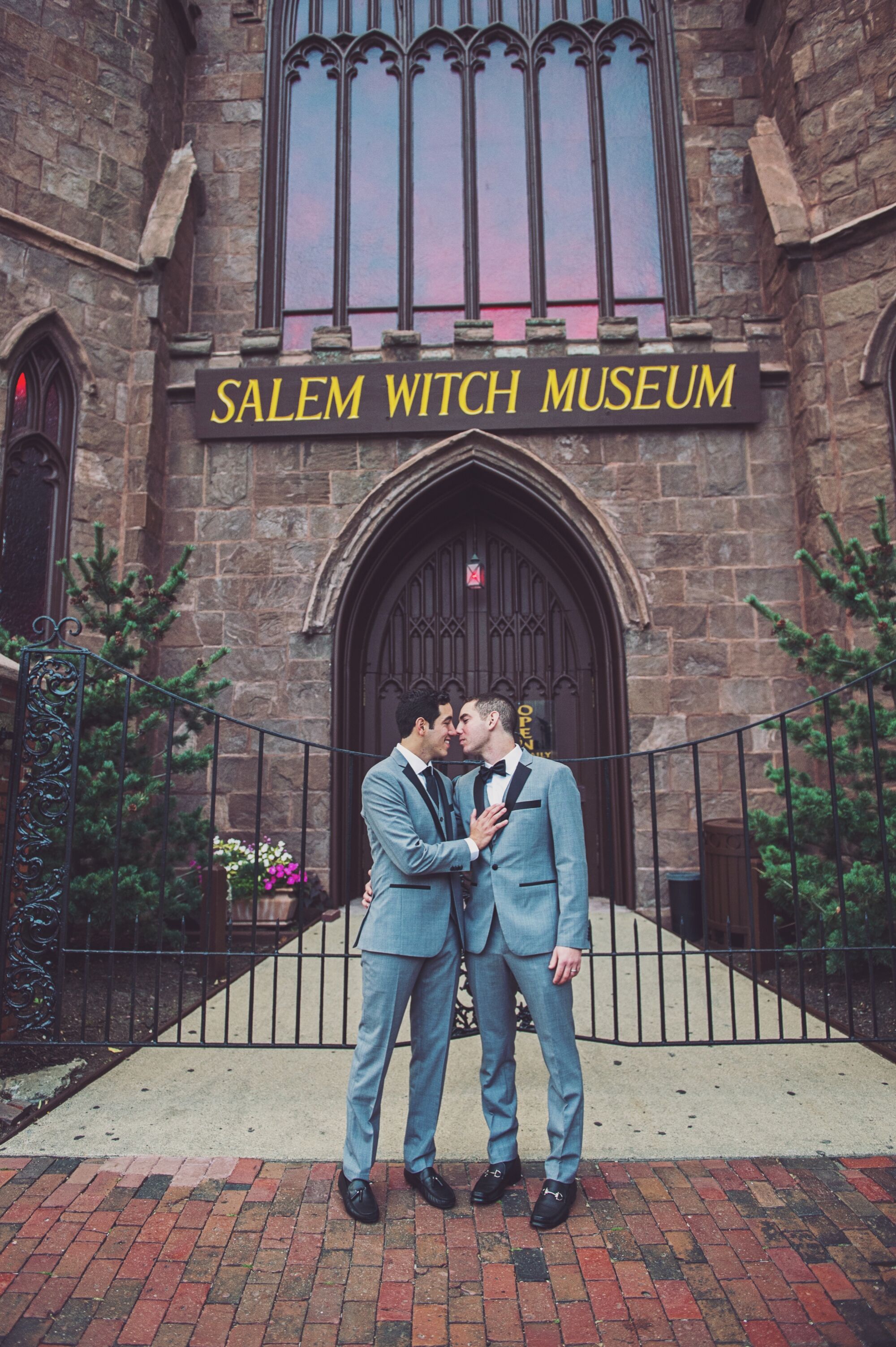 Close Embrace in front of a Gated Salem Witch Museum