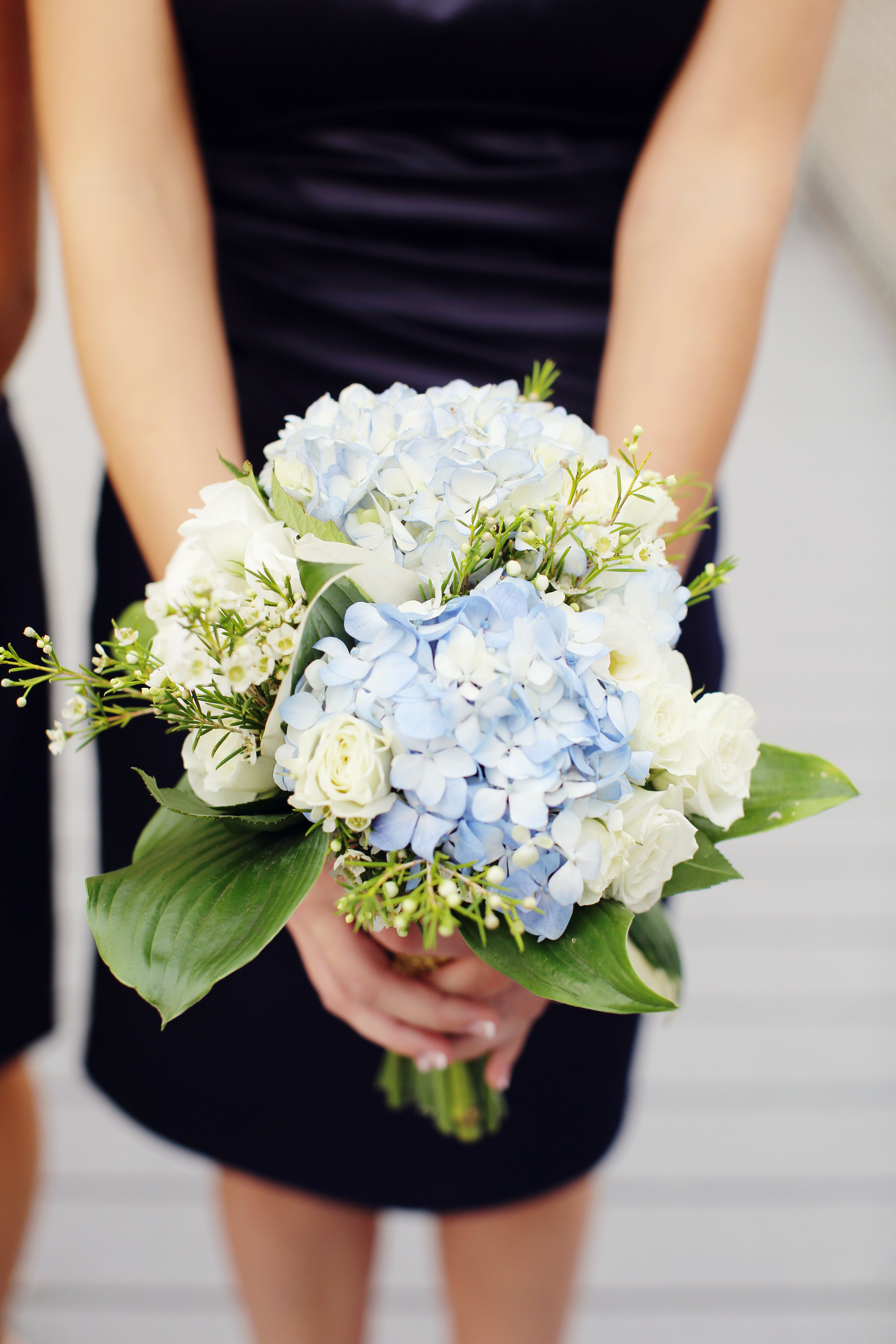 blue hydrangea and white rose boutonniere