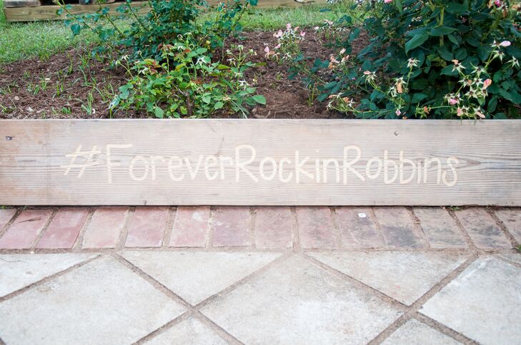 Wood planter with wedding hashtag sign